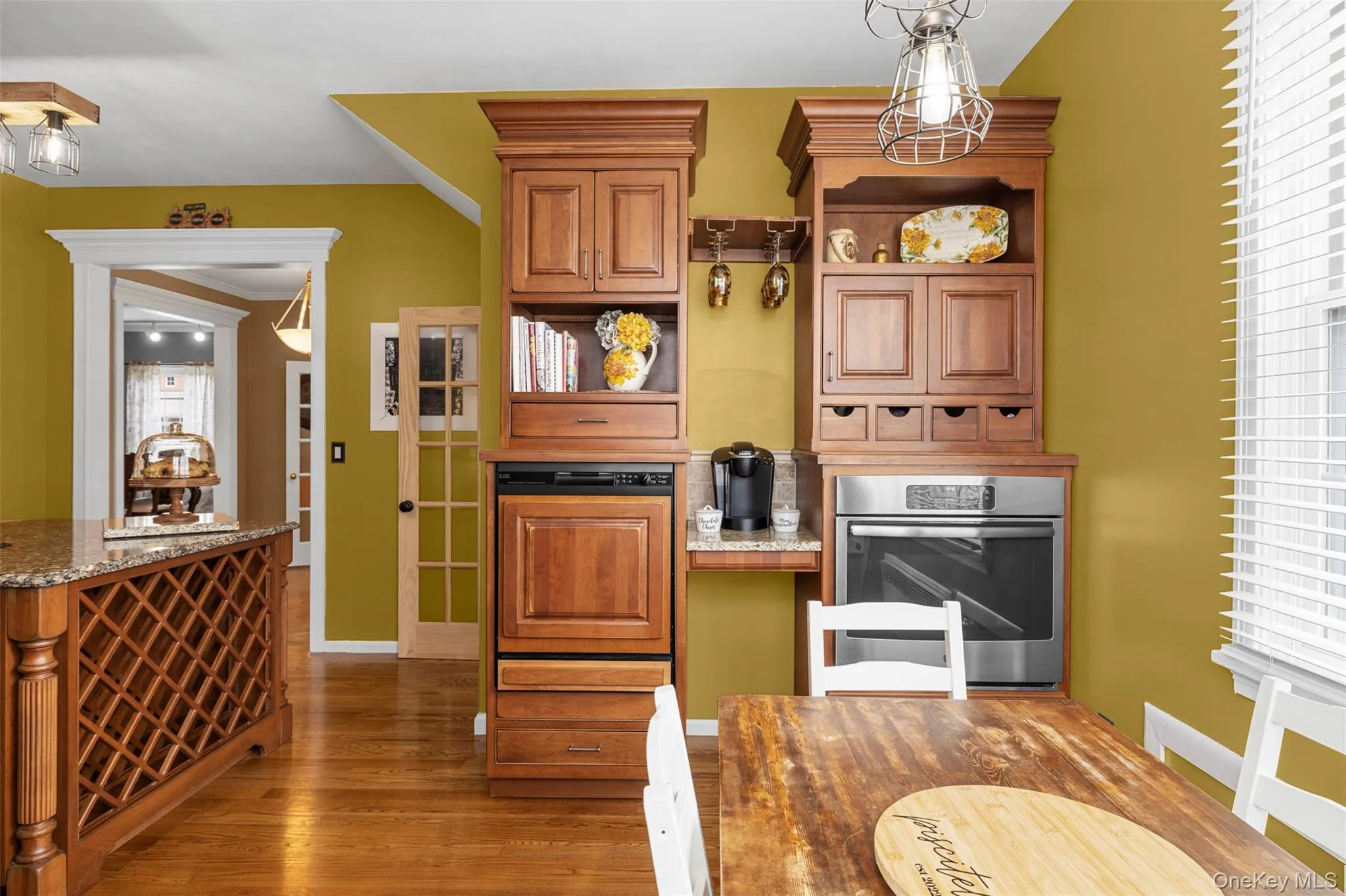 Kitchen with center island, eating nook, stainless steel appliances and pot filler Kitchen with center island, eating nook, stainless steel appliances and pot filler