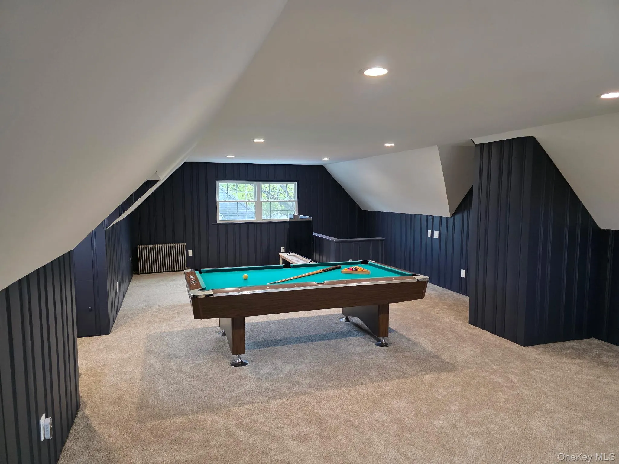 Bonus room on third floor for entertaining or guest quarters with lofted ceiling and full bath Bonus room on third floor for entertaining or guest quarters with lofted ceiling and full bath