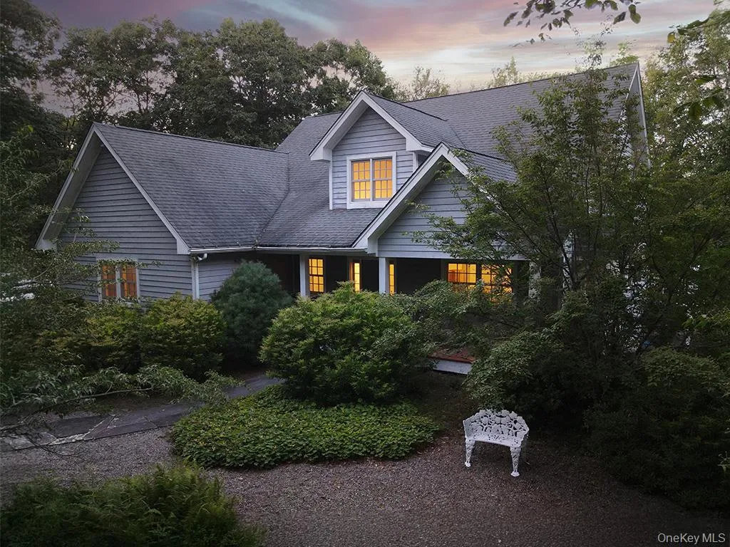 View of front of home featuring a shingled roof View of front of home featuring a shingled roof
