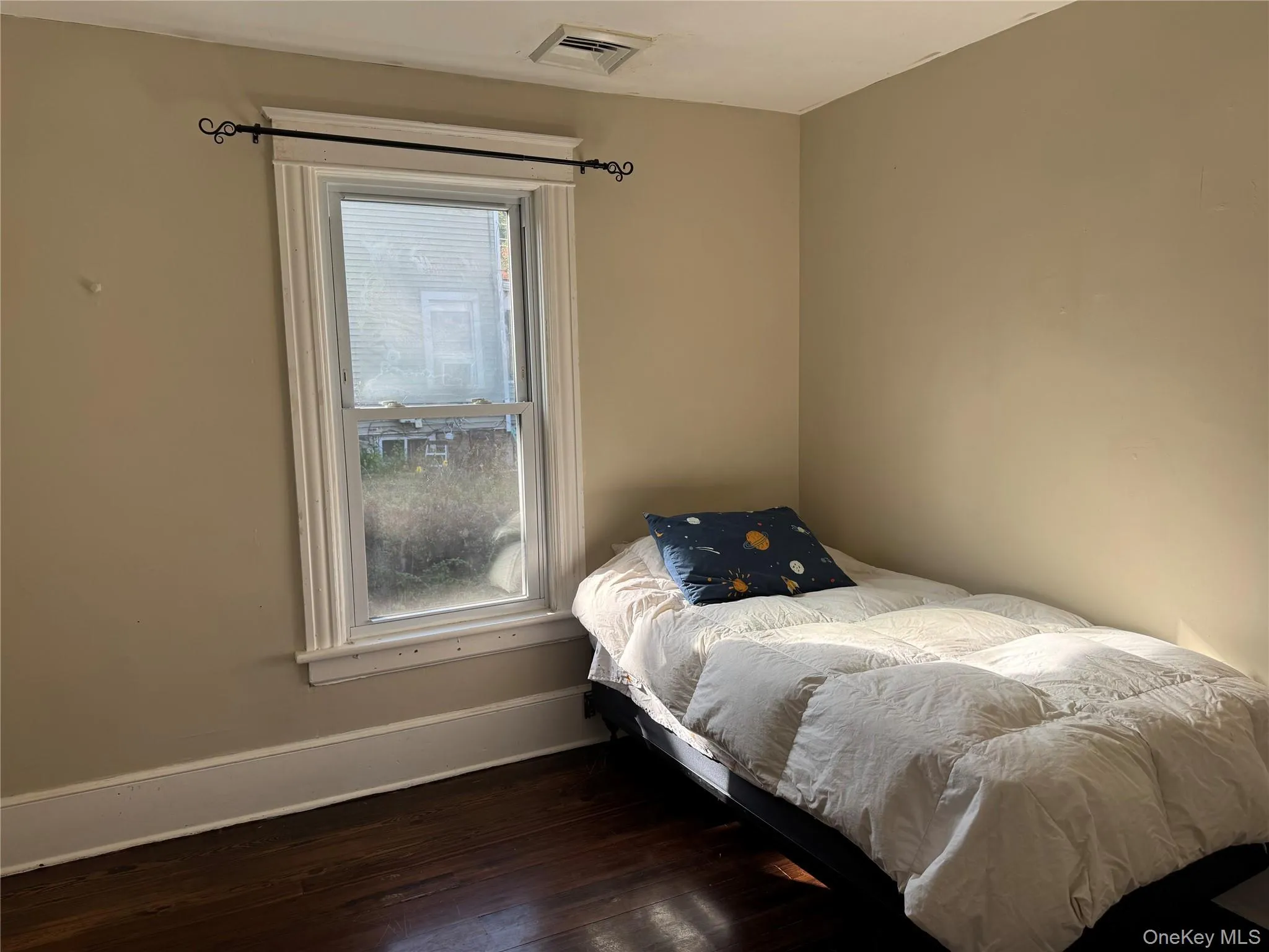Hardwood flooring paired with neutral wall tones and white trim Hardwood flooring paired with neutral wall tones and white trim
