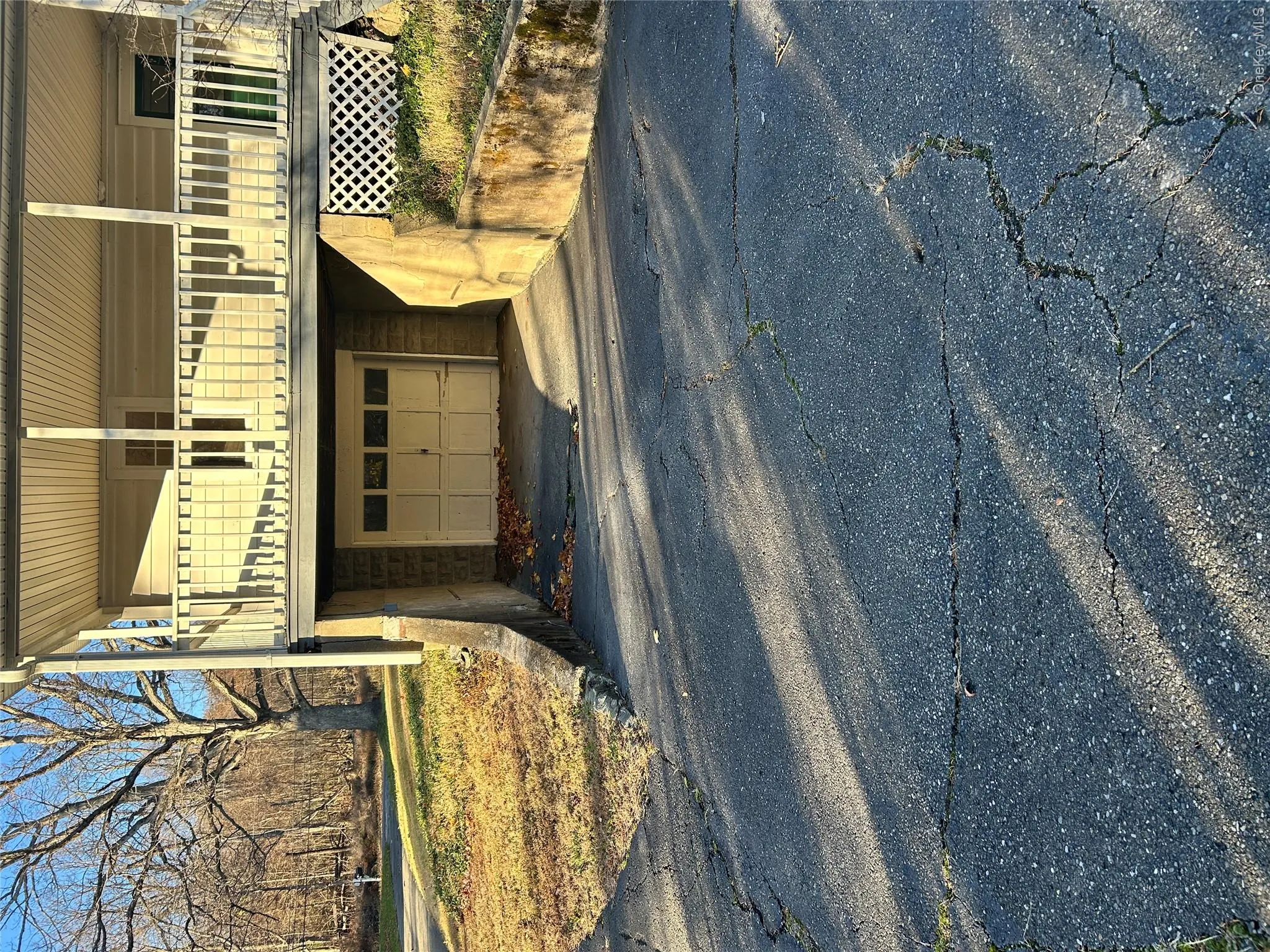 Garage featuring asphalt driveway Garage featuring asphalt driveway