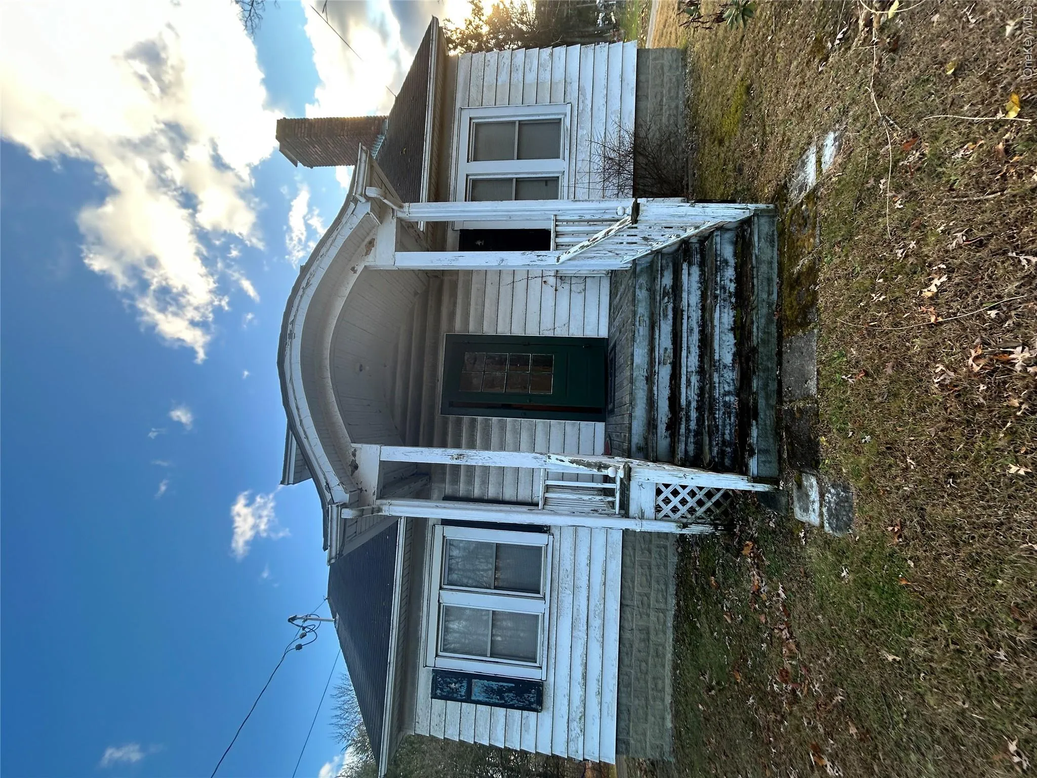 View of front of property with a chimney and a porch View of front of property with a chimney and a porch