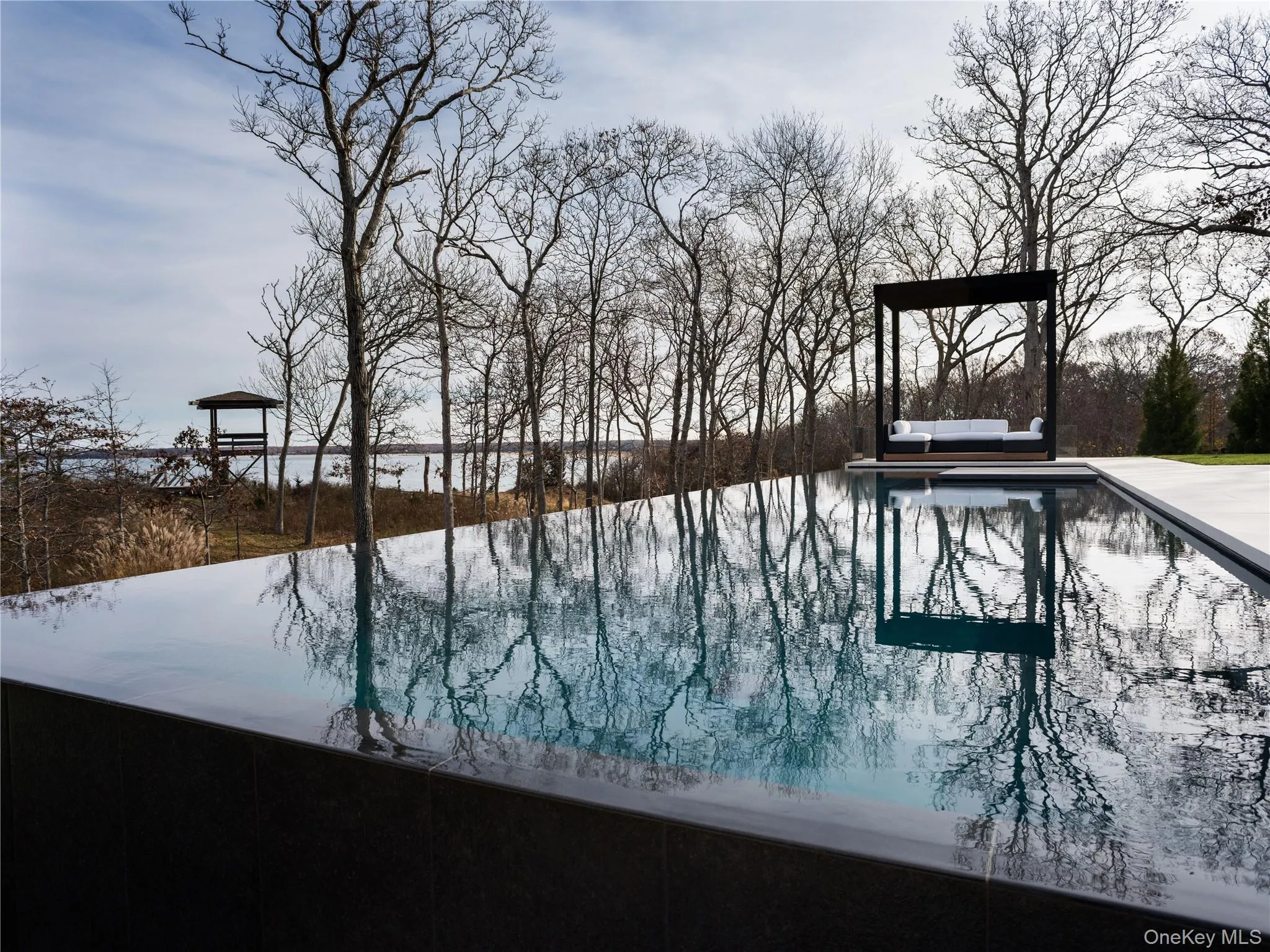 Heated gunite pool facing the water view Heated gunite pool facing the water view