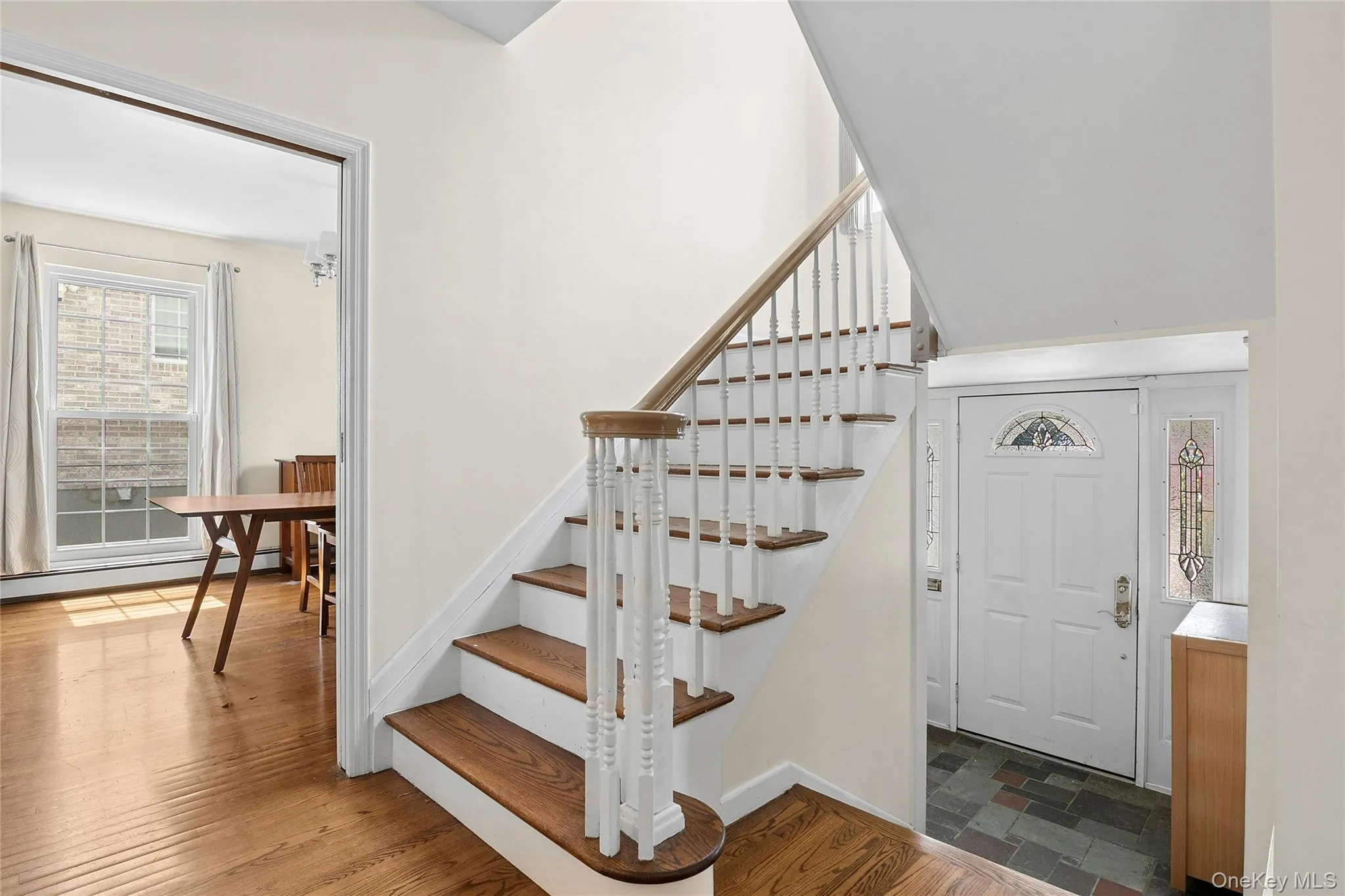 Entrance Foyer with Staircase to second floor and view to the Dining Room Entrance Foyer with Staircase to second floor and view to the Dining Room