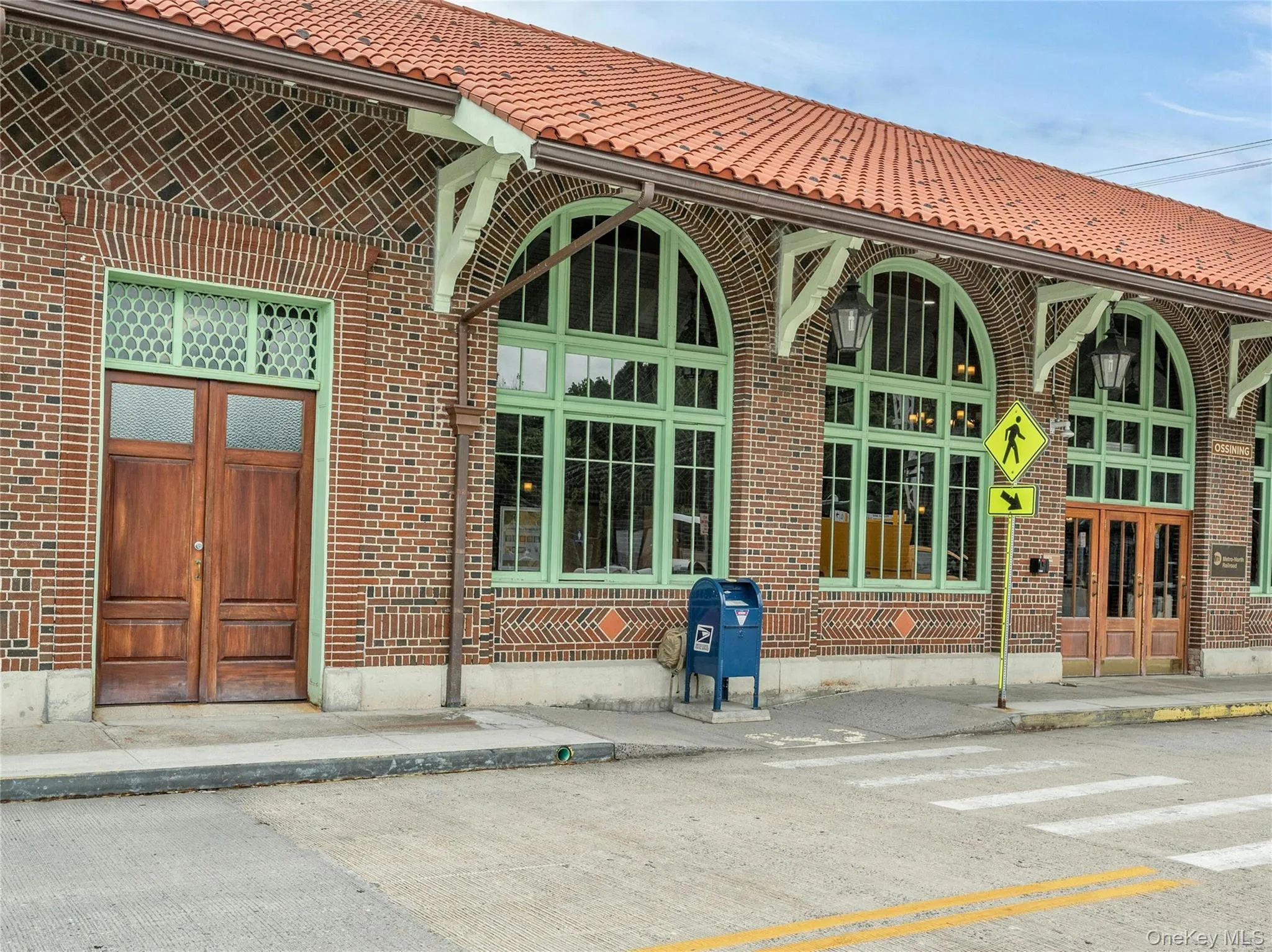 Property entrance with brick siding and a tiled roof Property entrance with brick siding and a tiled roof