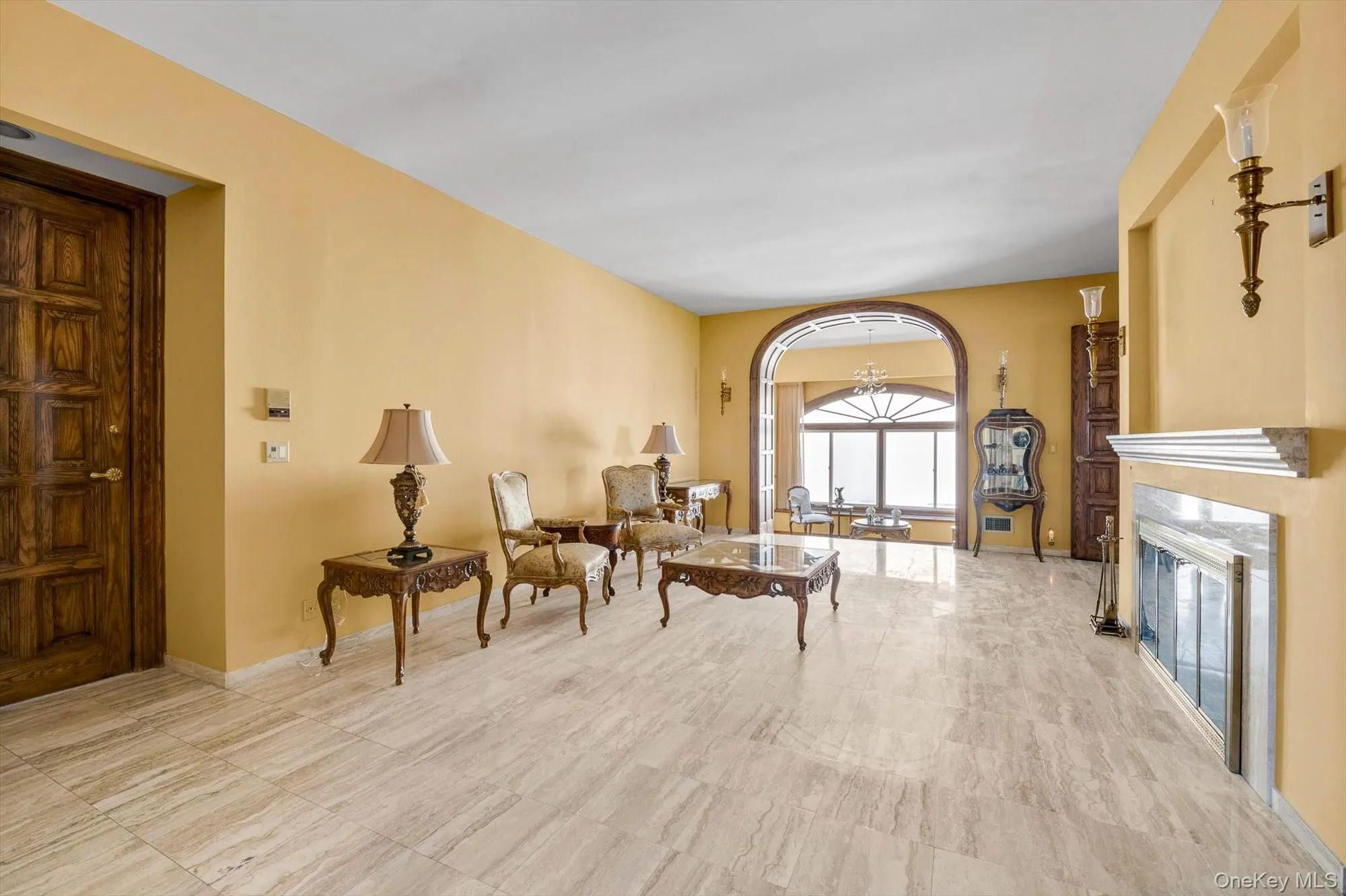 Formal Living Room with Fireplace and Sunken Sitting Room Formal Living Room with Fireplace and Sunken Sitting Room
