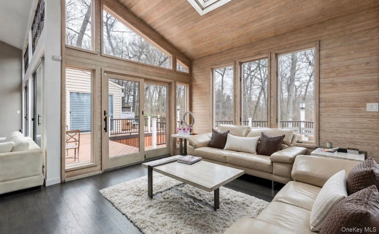 Vaulted wood-paneled ceiling with skylight and wood-finish walls Vaulted wood-paneled ceiling with skylight and wood-finish walls