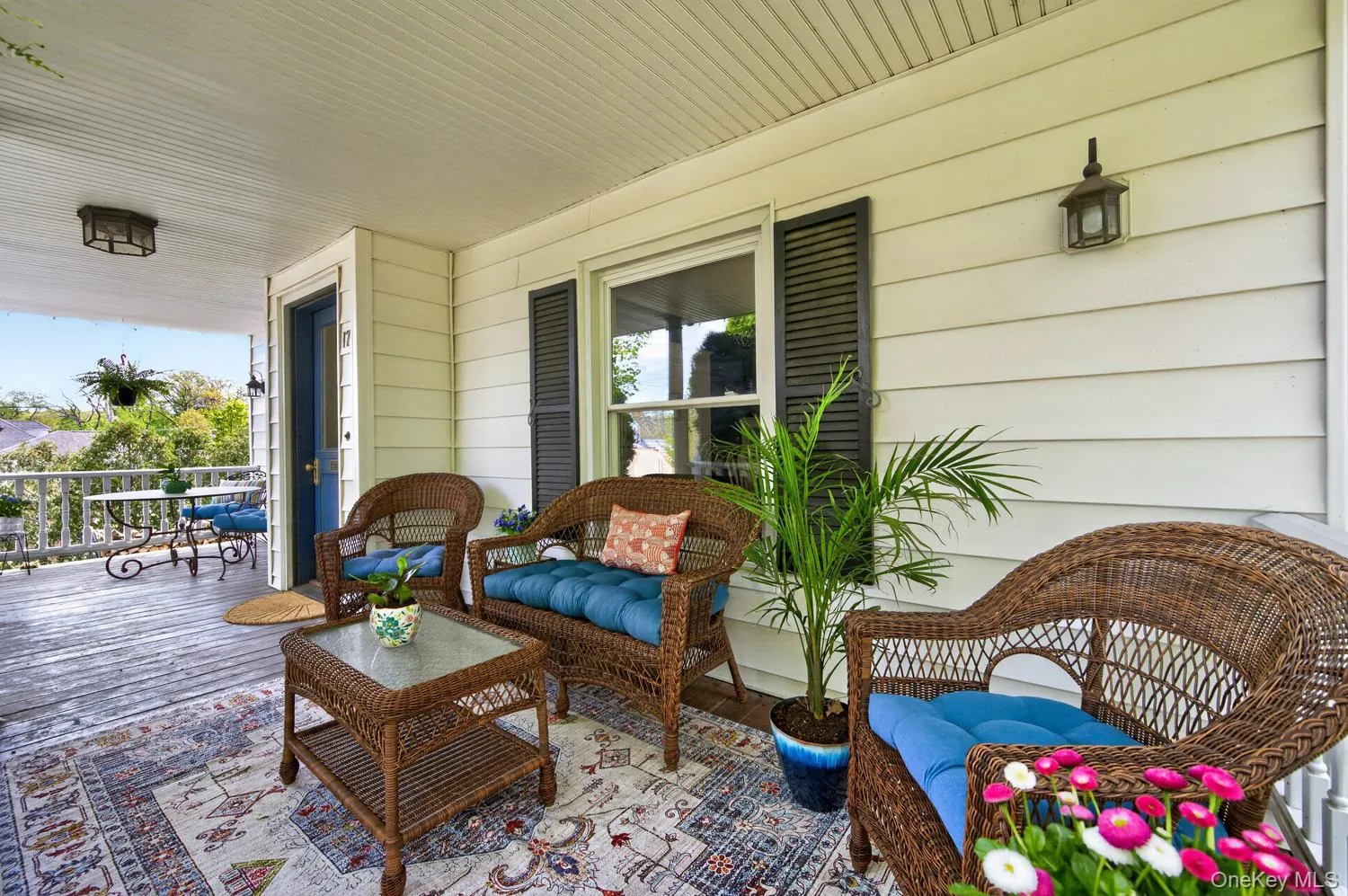 Front porch which spans across the front of the home Front porch which spans across the front of the home