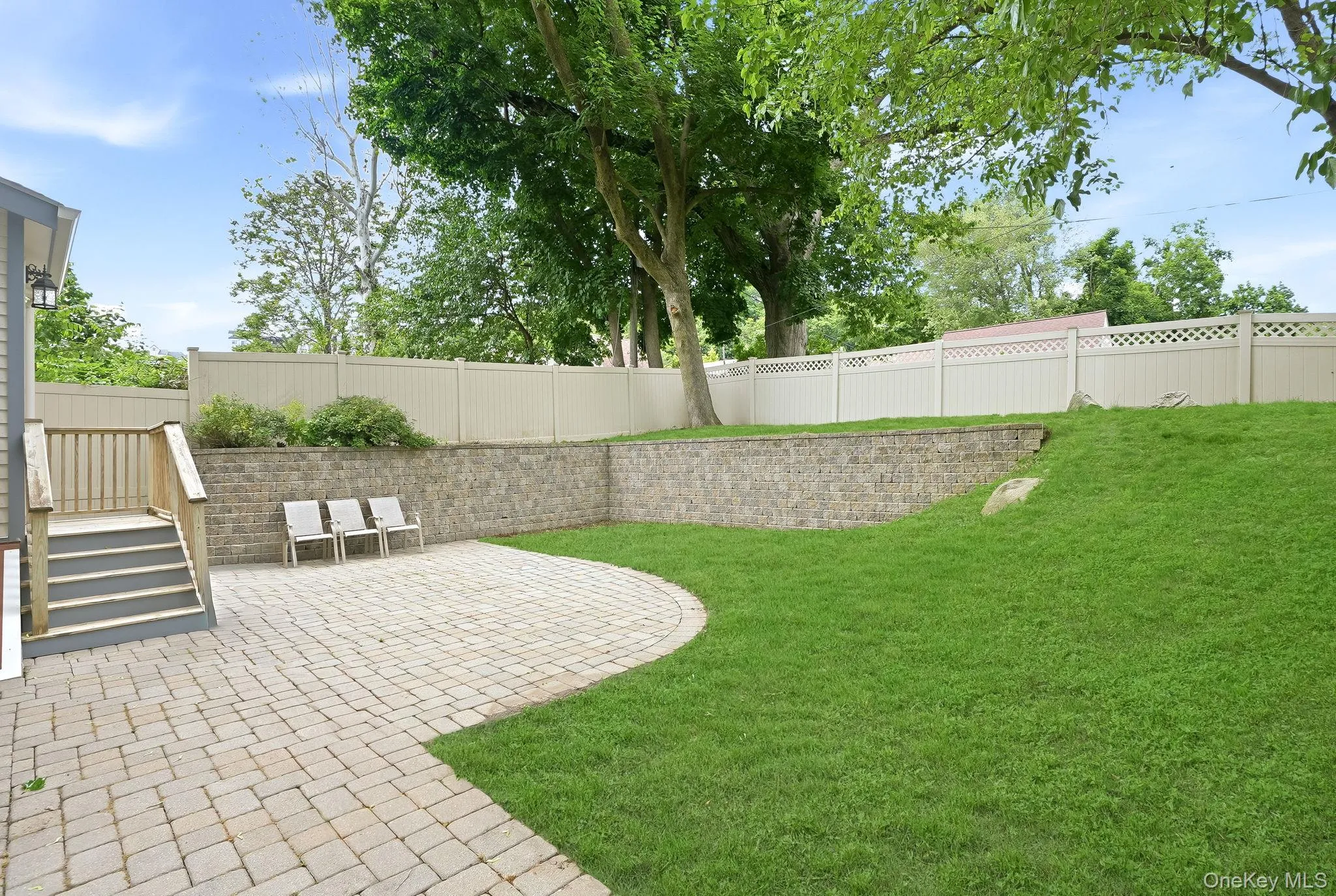 Attractive rear garden with low maintenance yard. Attractive rear garden with low maintenance yard.