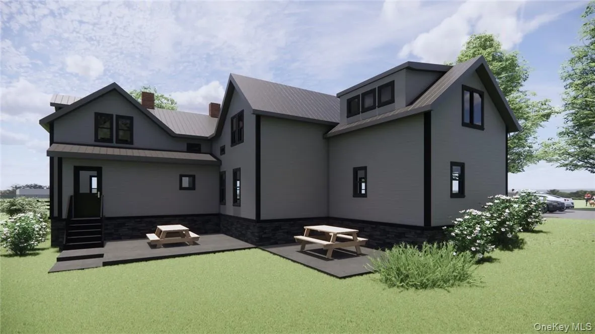 View of Back of house featuring a patio area and a lawn View of Back of house featuring a patio area and a lawn