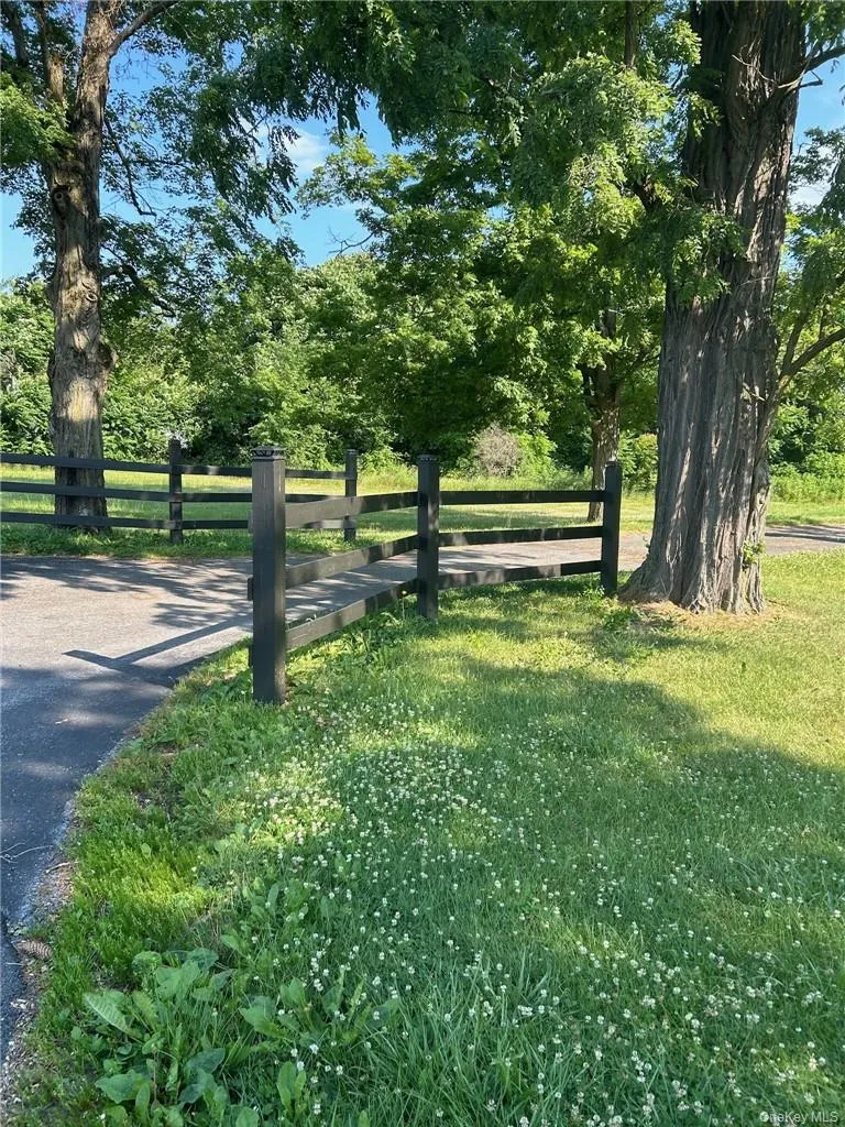 View of property's community featuring a yard View of property's community featuring a yard