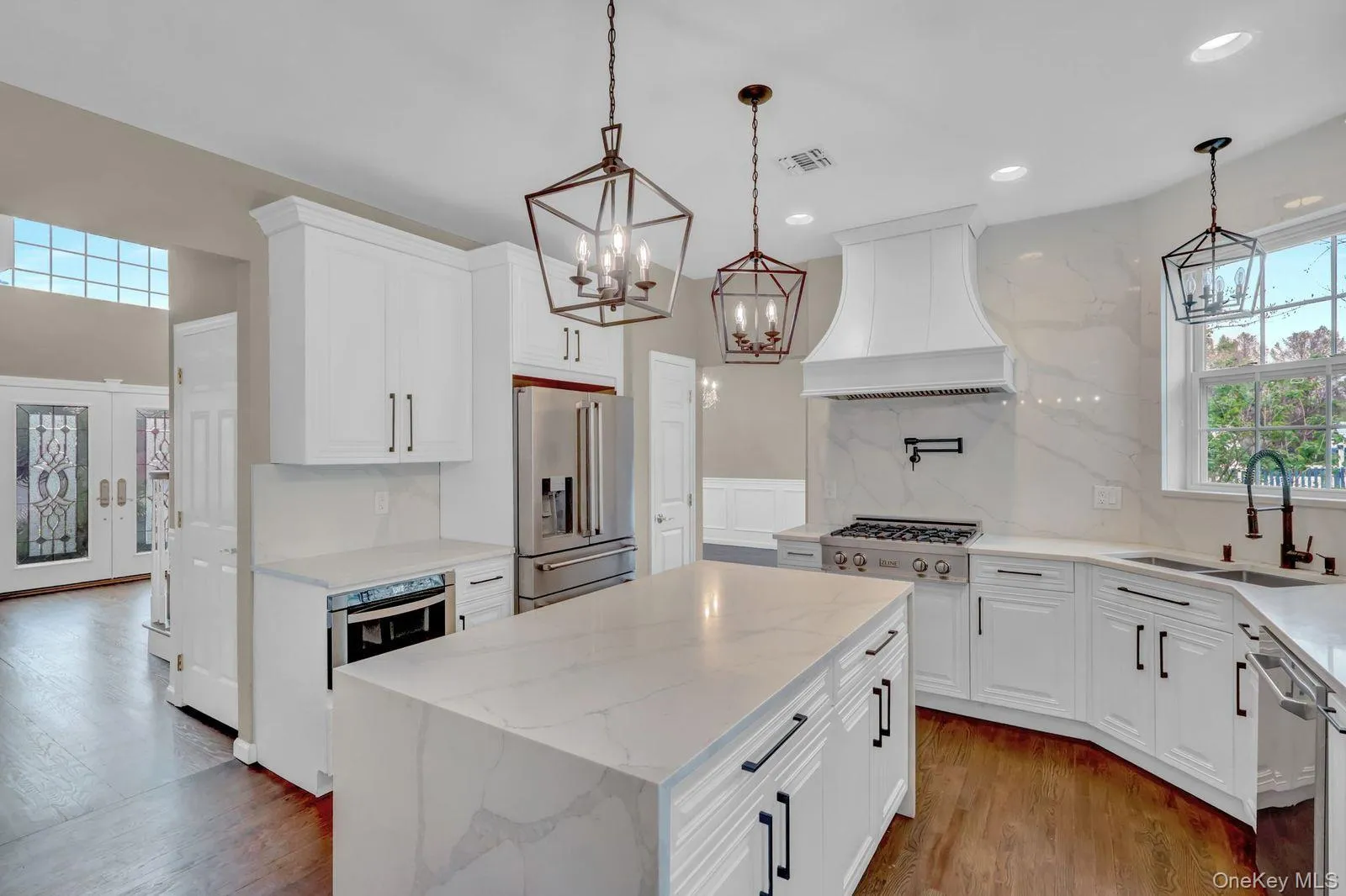 Updated Kitchen with Waterfall Island and Contemporary Lighting Updated Kitchen with Waterfall Island and Contemporary Lighting