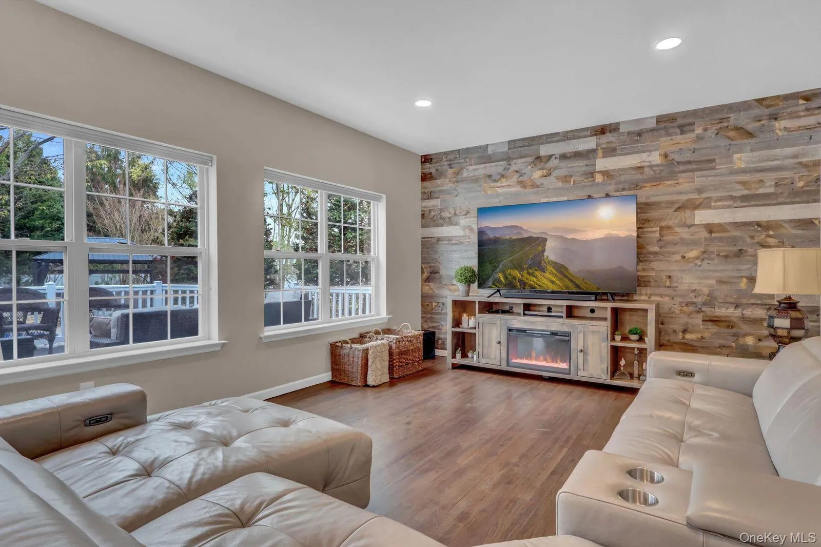 Family Room Featuring a Wood Accent Wall and Backyard Views Family Room Featuring a Wood Accent Wall and Backyard Views