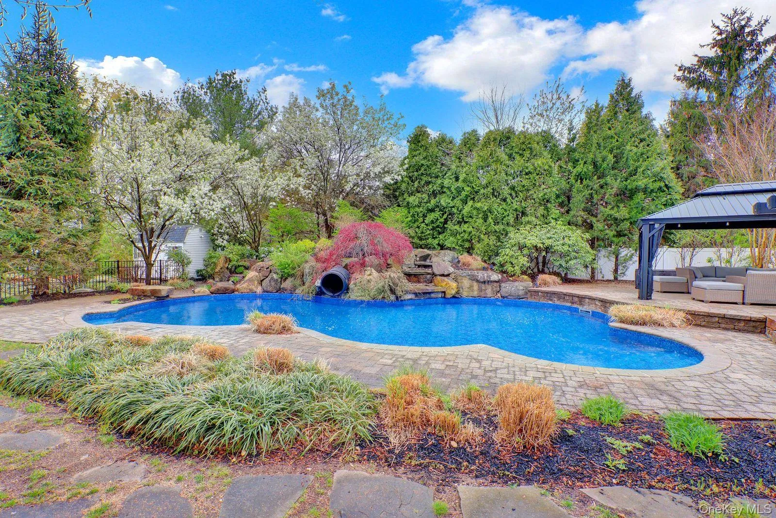 Heated Salt Water Pool with a Tunnel Slide and Rock Waterfall Heated Salt Water Pool with a Tunnel Slide and Rock Waterfall