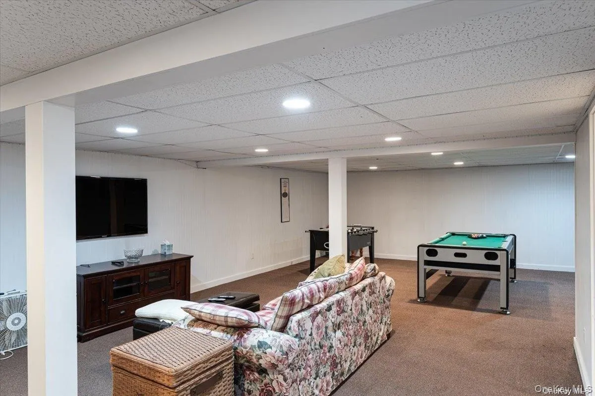 Finished basement recreation area featuring recessed lighting Finished basement recreation area featuring recessed lighting