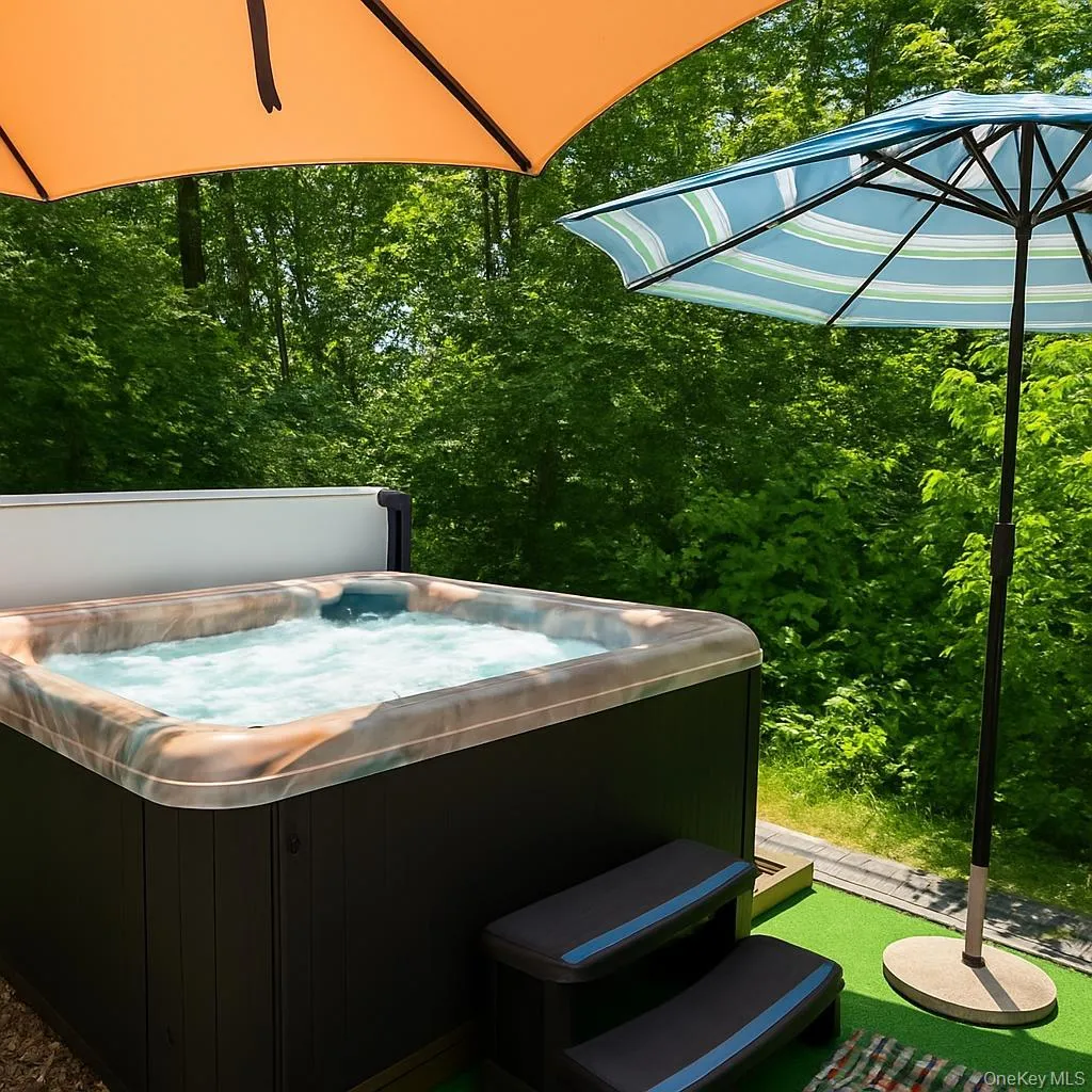 This beautiful spa is perfectly positioned to overlook the gently flowing creek, creating a peaceful, retreat-like setting. Surrounded by nature, it offers a private escape where you can unwind while listening to the soothing sounds of the water below. This beautiful spa is perfectly positioned to overlook the gently flowing creek, creating a peaceful, retreat-like setting. Surrounded by nature, it offers a private escape where you can unwind while listening to the soothing sounds of the water below.