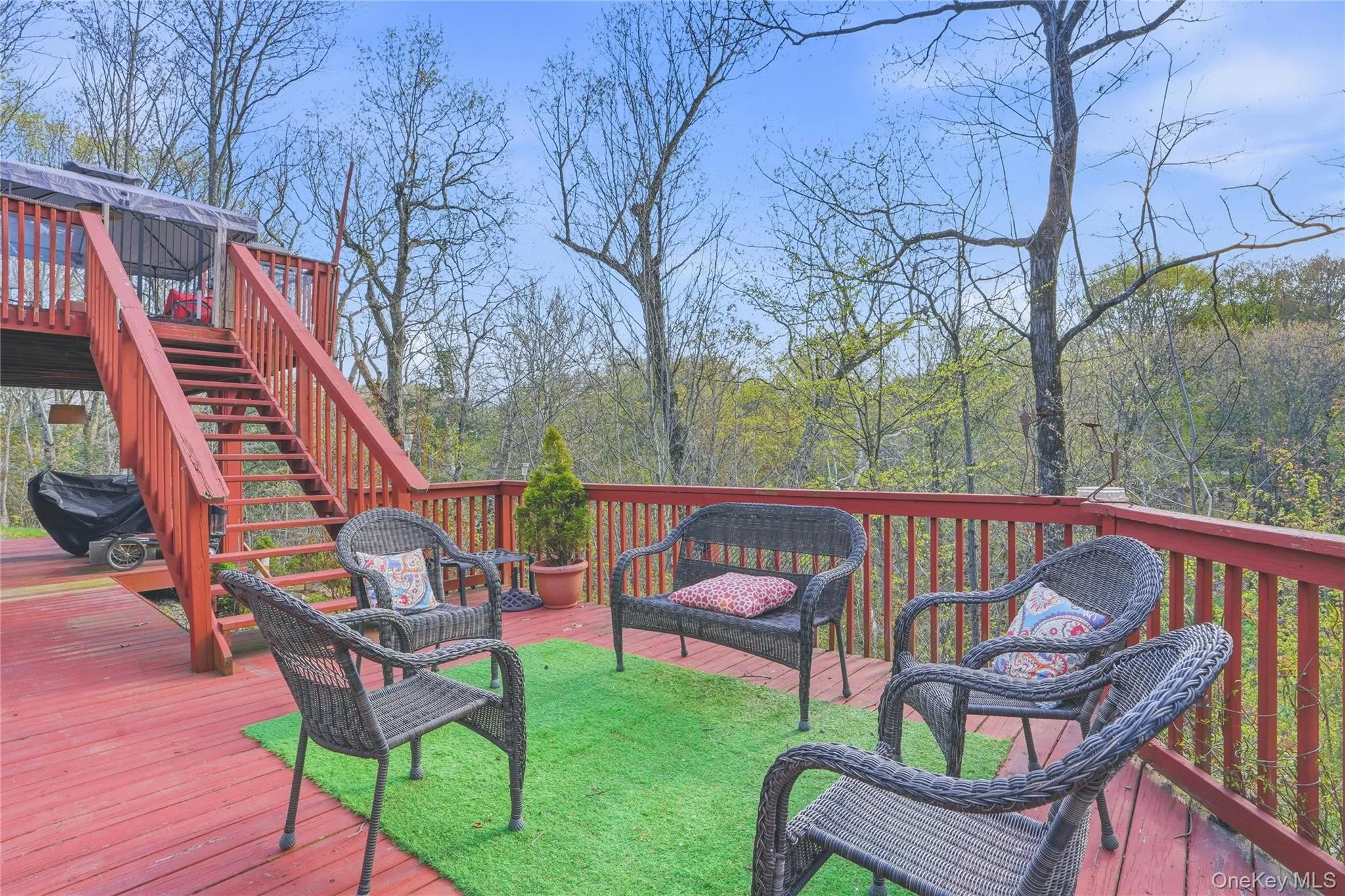 The two-tiered deck offers a stunning outdoor retreat, perfectly positioned to overlook a beautiful, gently flowing creek. The two-tiered deck offers a stunning outdoor retreat, perfectly positioned to overlook a beautiful, gently flowing creek.