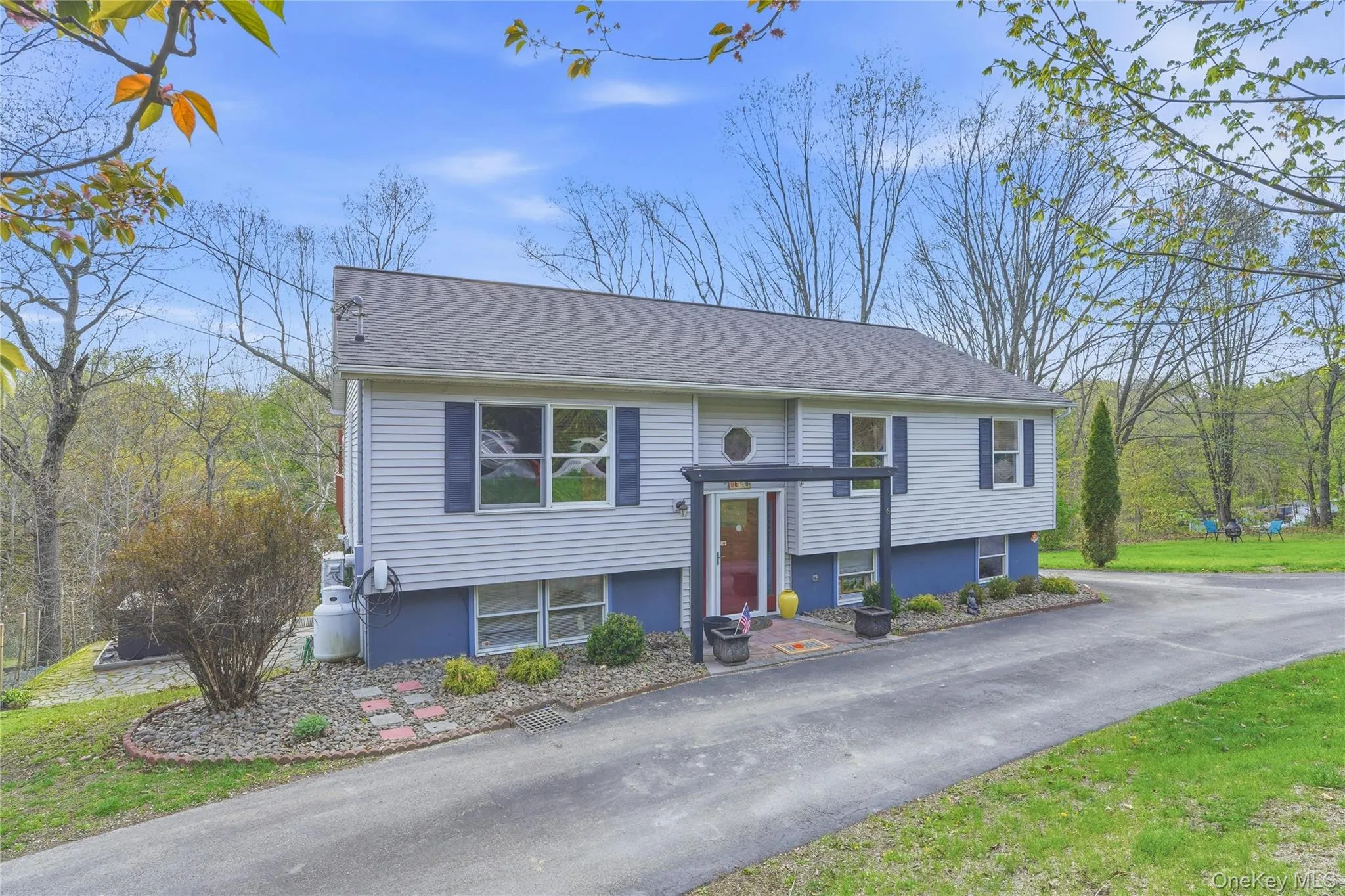 This beautiful home is surrounded by greenery, the setting feels peaceful and private, making it as attractive on the outside as it is practical. This beautiful home is surrounded by greenery, the setting feels peaceful and private, making it as attractive on the outside as it is practical.