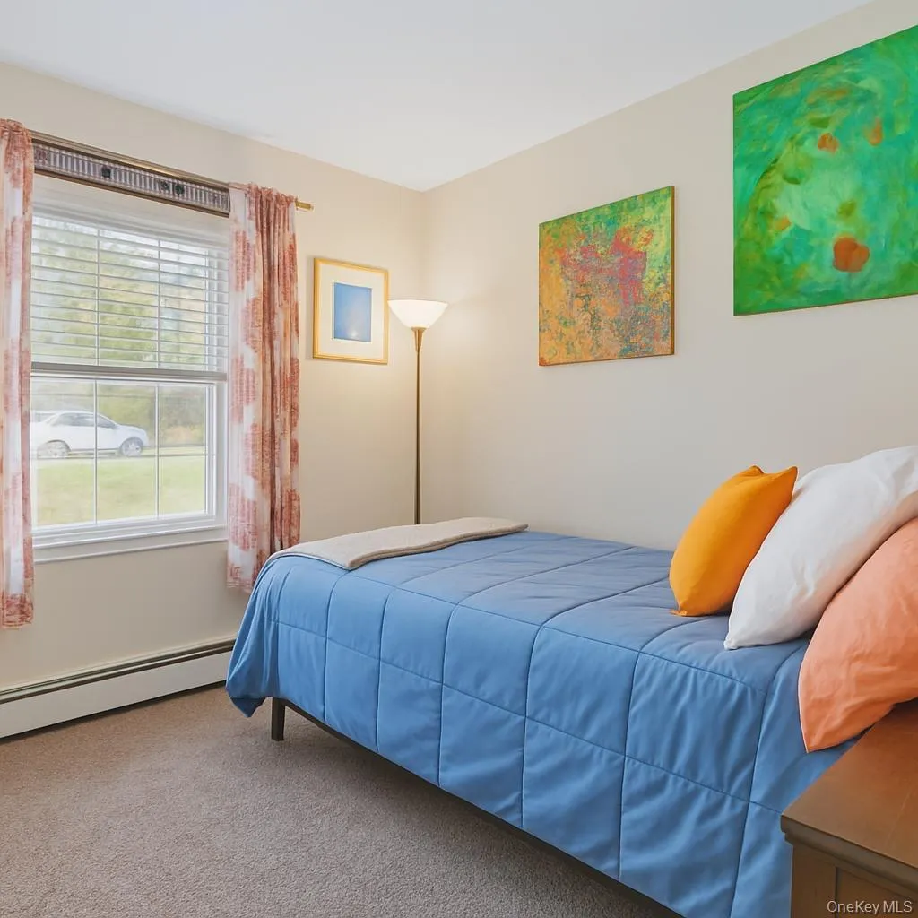 This comfortable bedroom offers a simple, functional layout with a pleasant sense of light and space. A well-placed window brings in natural sunlight, brightening the room and creating a warm, inviting atmosphere throughout the day. This comfortable bedroom offers a simple, functional layout with a pleasant sense of light and space. A well-placed window brings in natural sunlight, brightening the room and creating a warm, inviting atmosphere throughout the day.