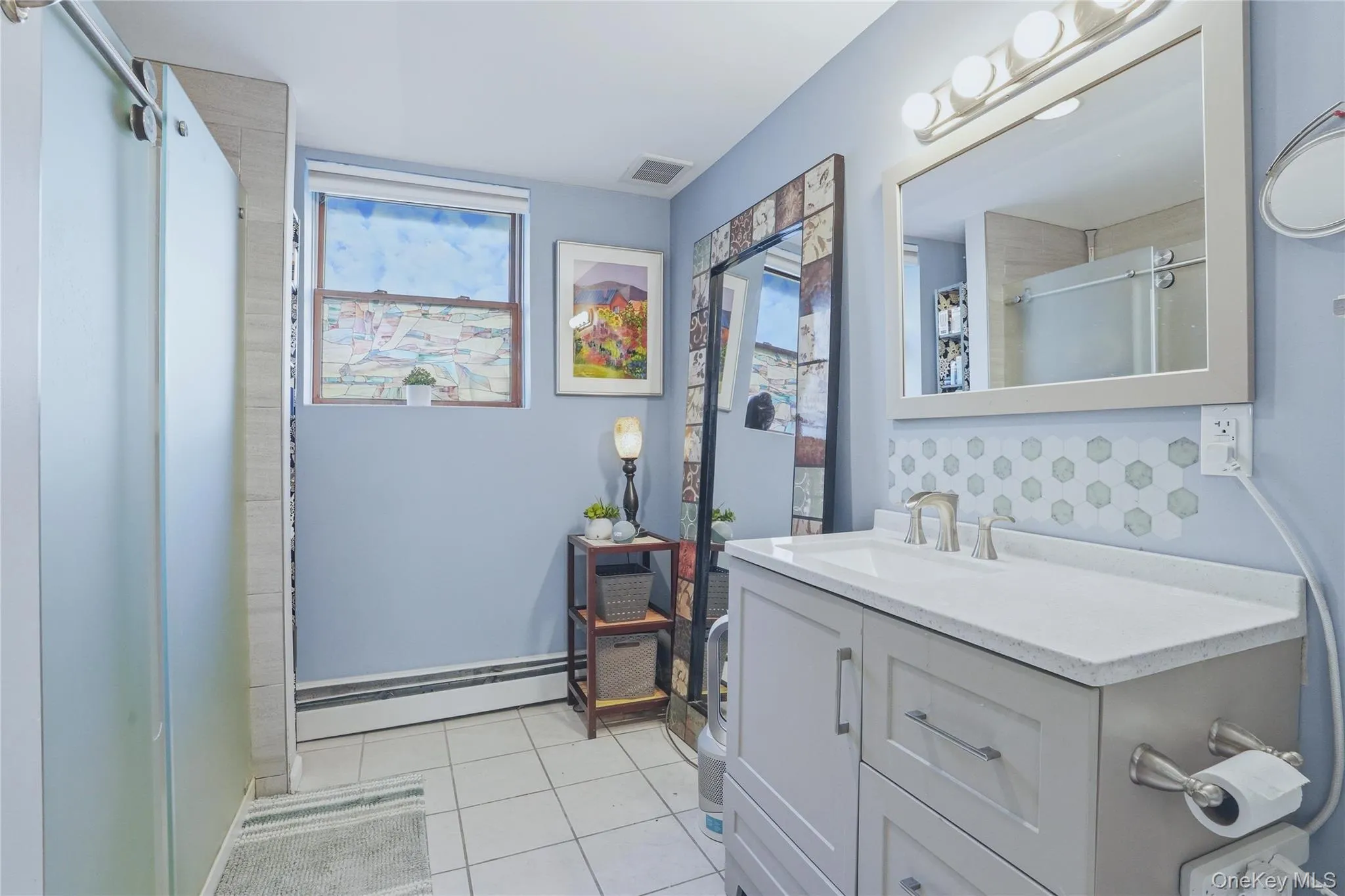 The full bathroom on the lower level of this mother-daughter raised ranch is thoughtfully designed for comfort and convenience. Featuring a complete setup with a shower, vanity, and toilet, it offers everything needed for independent living. The full bathroom on the lower level of this mother-daughter raised ranch is thoughtfully designed for comfort and convenience. Featuring a complete setup with a shower, vanity, and toilet, it offers everything needed for independent living.