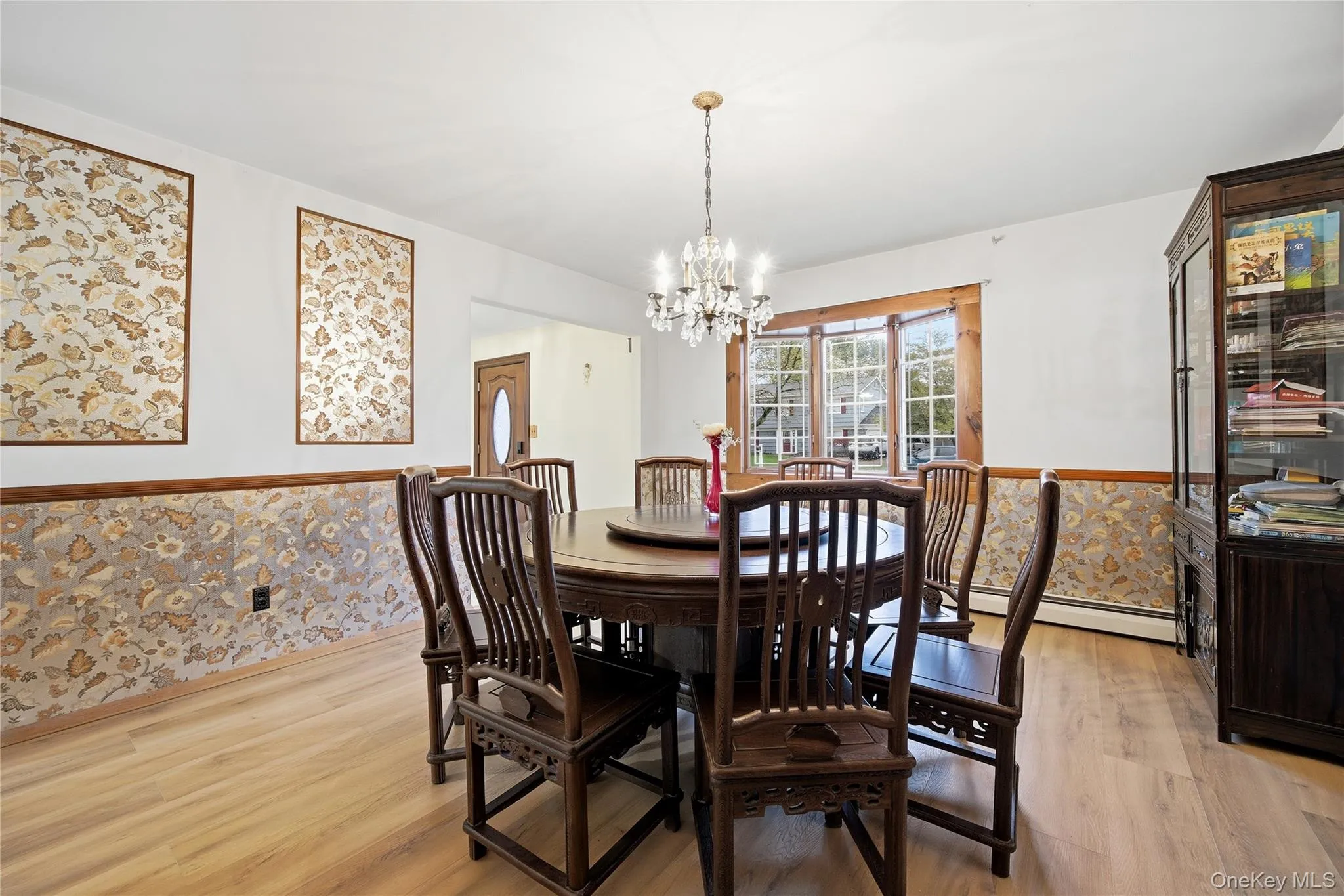 Light wood-finish flooring complements the room's design Light wood-finish flooring complements the room's design