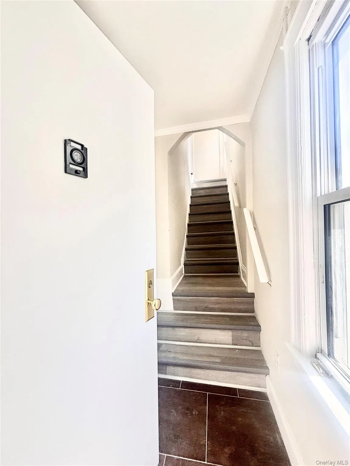 Entrance staircase beyond the entrance door. Entrance staircase beyond the entrance door.