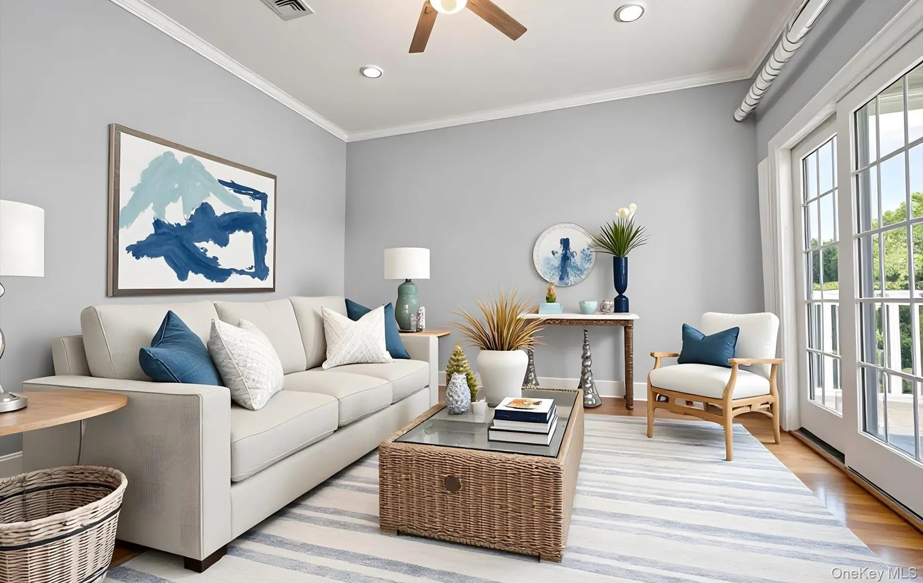 Bright living space featuring French doors, wood-finish flooring, crown molding, a ceiling fan, and recessed lighting Bright living space featuring French doors, wood-finish flooring, crown molding, a ceiling fan, and recessed lighting