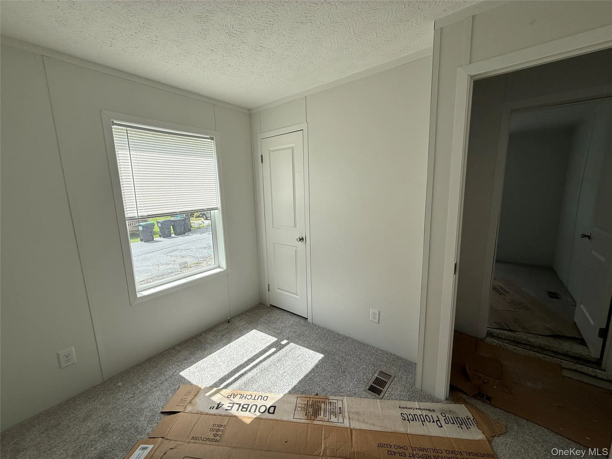 Unfurnished bedroom featuring a textured ceiling Unfurnished bedroom featuring a textured ceiling
