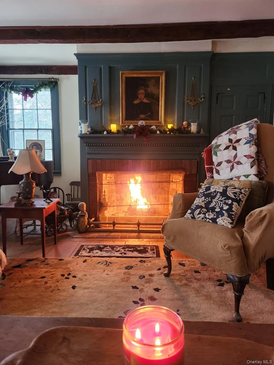 Living area with a brick fireplace lit for those cool nights. Living area with a brick fireplace lit for those cool nights.