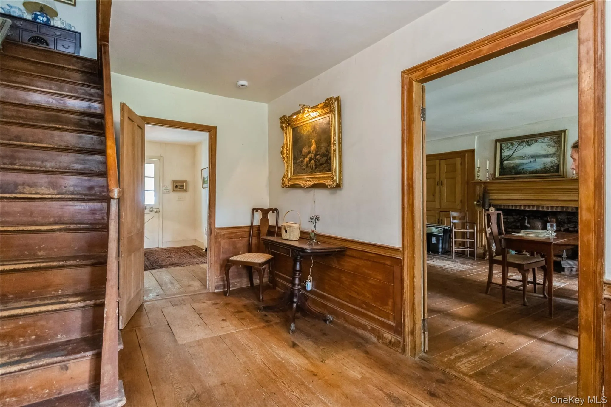Hall featuring wainscoting and wide board flrs Hall featuring wainscoting and wide board flrs