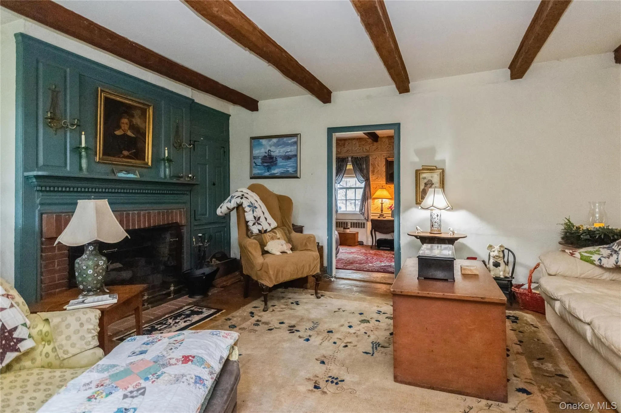 Living area with beam ceiling, a brick fireplace Living area with beam ceiling, a brick fireplace
