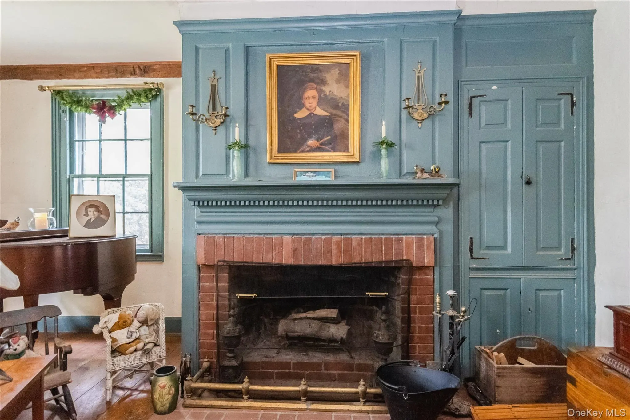 Detailed view of a working fireplace. Original mantle and cabinets Detailed view of a working fireplace. Original mantle and cabinets