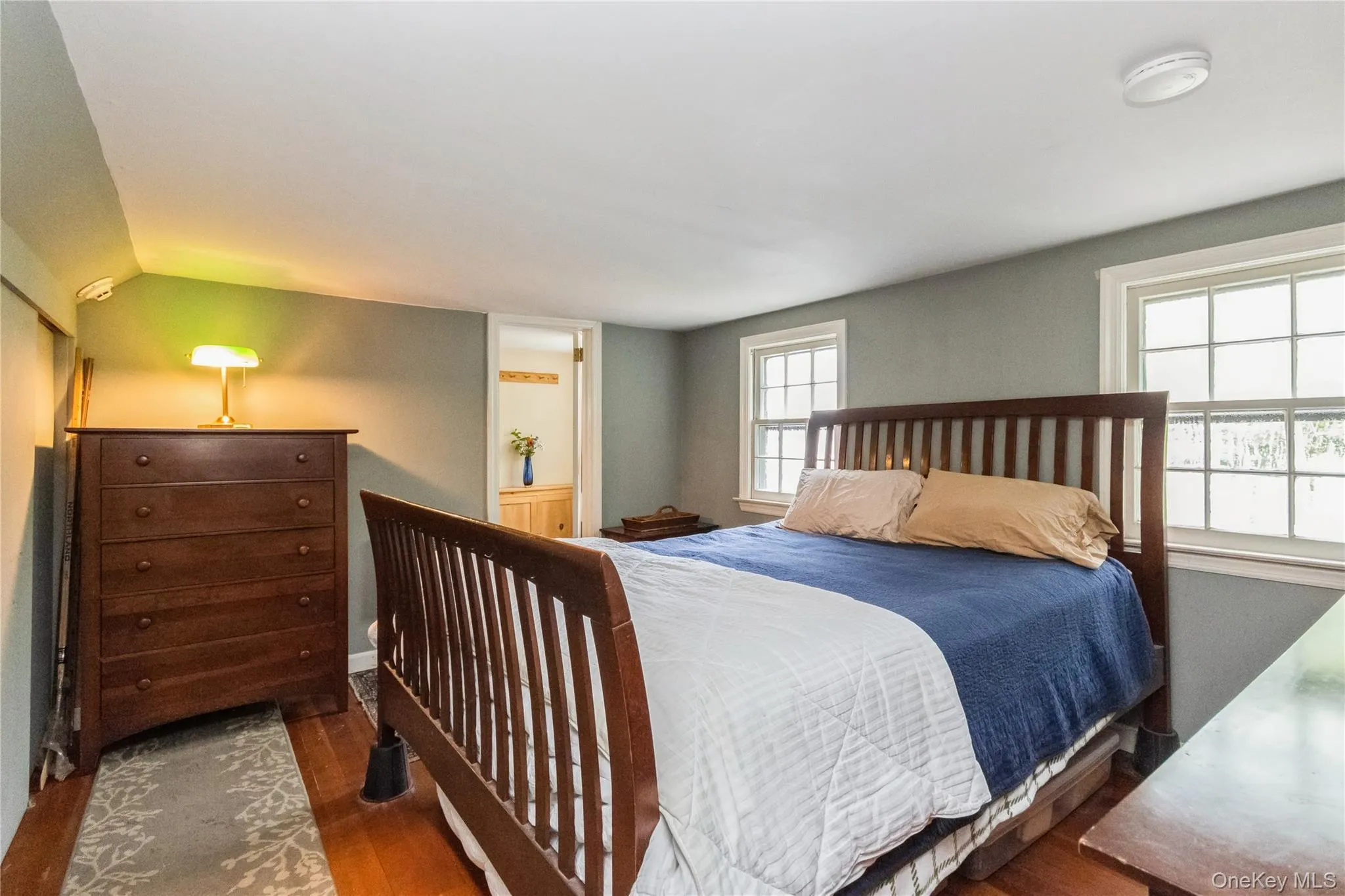Ensuite wing Bedroom with wood finished floors, full bath Ensuite wing Bedroom with wood finished floors, full bath