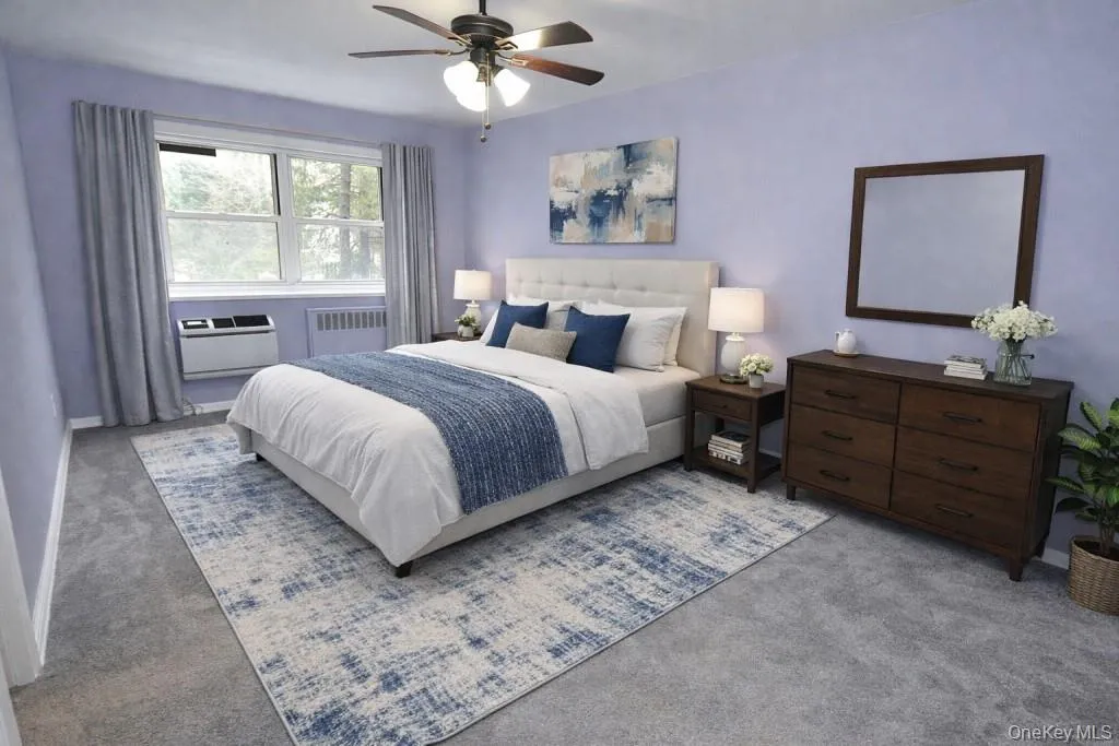 Virtually Staged Photo. The large main bedroom is almost as large as the living room and has a wall of closets and covered refinished hardwood floors. The bedroom can easily accommodate a king size bed, dresser, night stands and reading chair. The bedroom is 16'-8" x 10'-7". Virtually Staged Photo. The large main bedroom is almost as large as the living room and has a wall of closets and covered refinished hardwood floors. The bedroom can easily accommodate a king size bed, dresser, night stands and reading chair. The bedroom is 16'-8" x 10'-7".