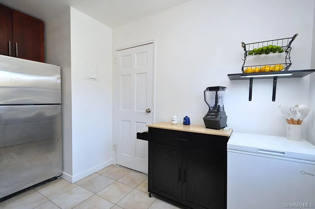 Renovated eat-in-Kitchen has Granite counters, 48" rosewood cabinets and Stainless Steel Appliances including a Dishwasher, microwave, range and refrigerator. Renovated eat-in-Kitchen has Granite counters, 48" rosewood cabinets and Stainless Steel Appliances including a Dishwasher, microwave, range and refrigerator.