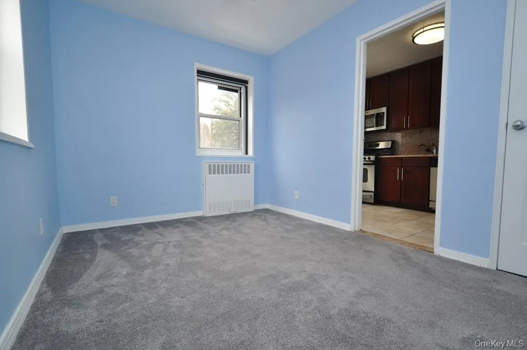 The corner second bedroom has covered hardwood floors. and can be used as a home office, den or guest room. The room is approx 11'-10' x 8'-9". The corner second bedroom has covered hardwood floors. and can be used as a home office, den or guest room. The room is approx 11'-10' x 8'-9".