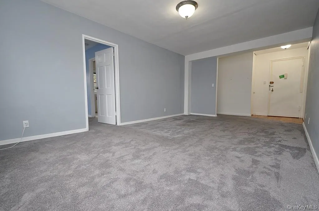 Large Living room can accommodate both a dining area and entertaining area. There are beautiful refinished covered floors. The room is approx 19'-6" x 11'-7" Large Living room can accommodate both a dining area and entertaining area. There are beautiful refinished covered floors. The room is approx 19'-6" x 11'-7"