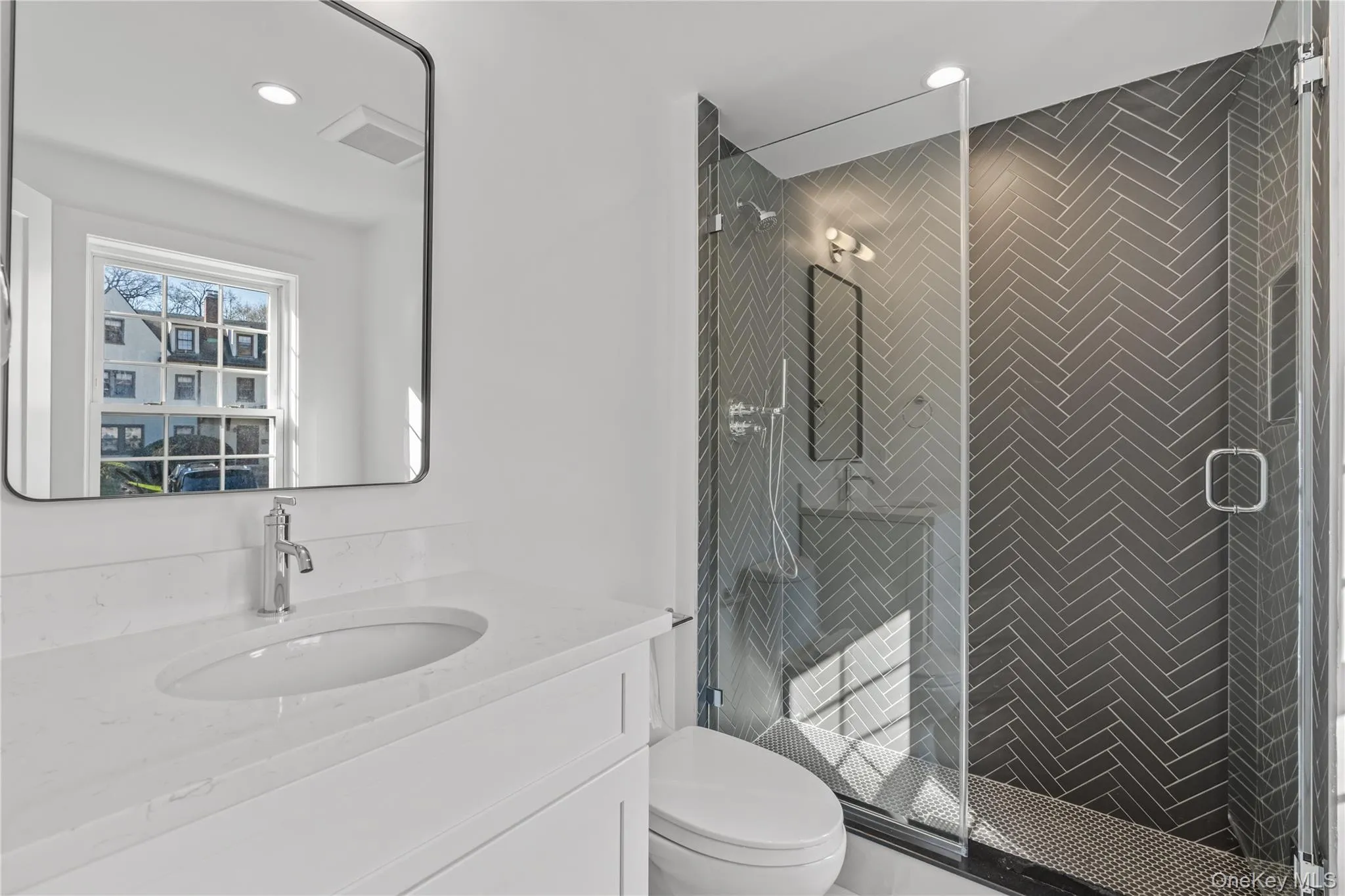Main level full bathroom located at front entry opposite mudroom. Main level full bathroom located at front entry opposite mudroom.