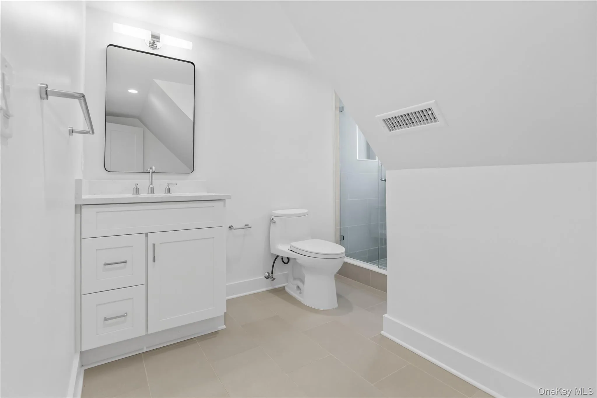 Third floor guest bathroom with stall shower. Third floor guest bathroom with stall shower.