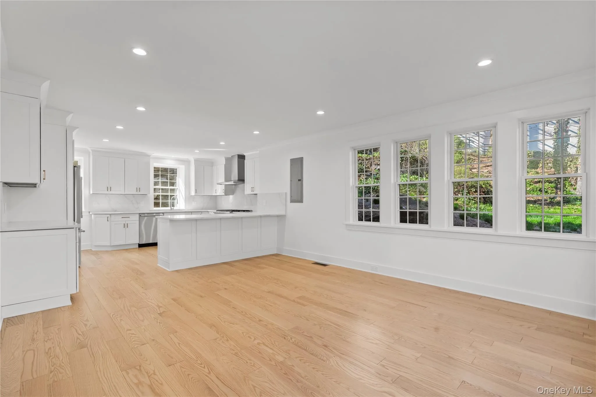 Open space kitchen/dining with windows all four sides. Open space kitchen/dining with windows all four sides.