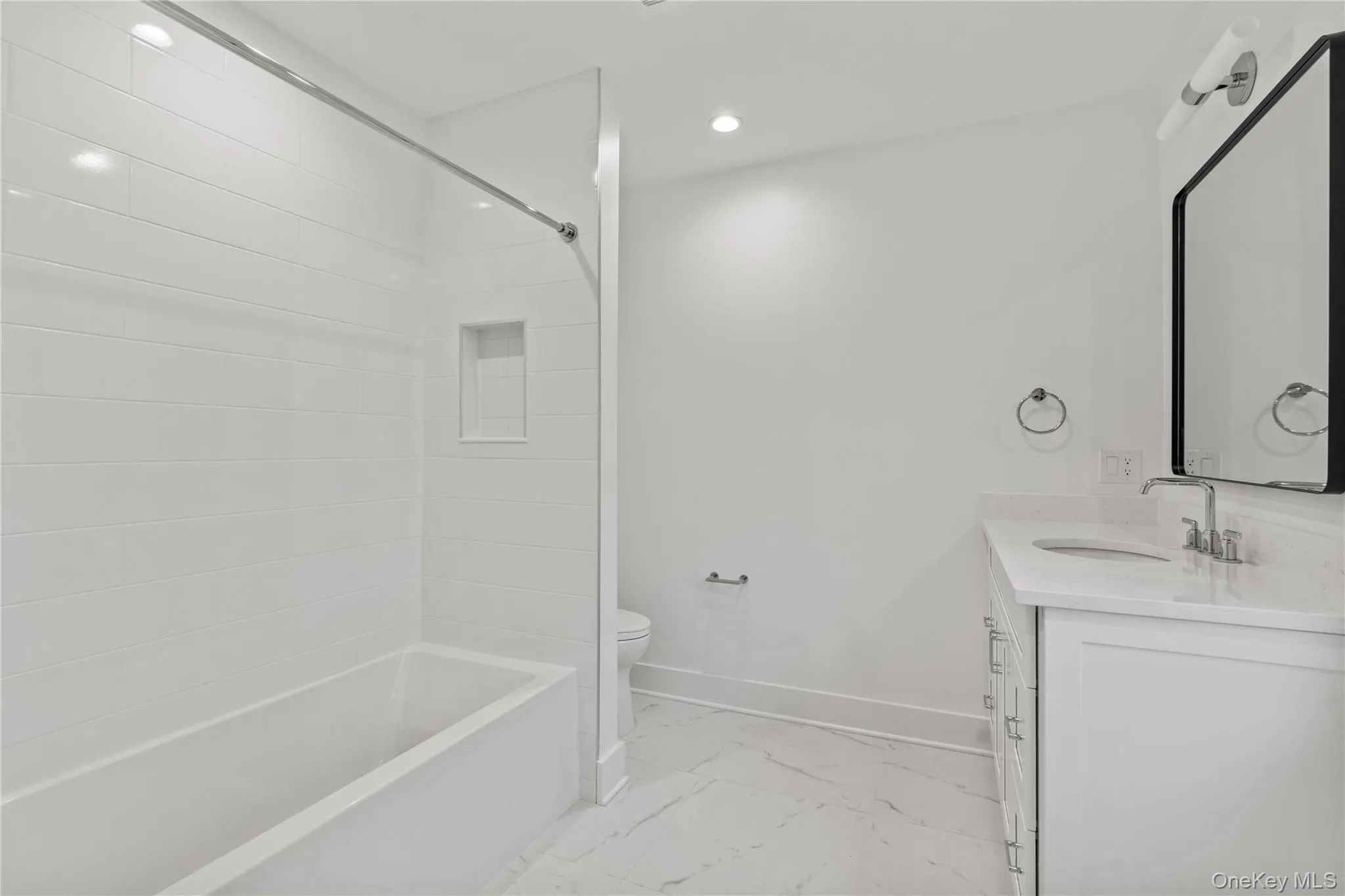 Second floor guest bathroom with tub/shower. Second floor guest bathroom with tub/shower.