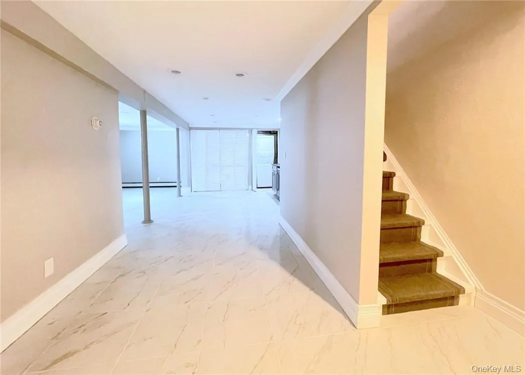 Entrance from Garage on right-stairway to main level Entrance from Garage on right-stairway to main level