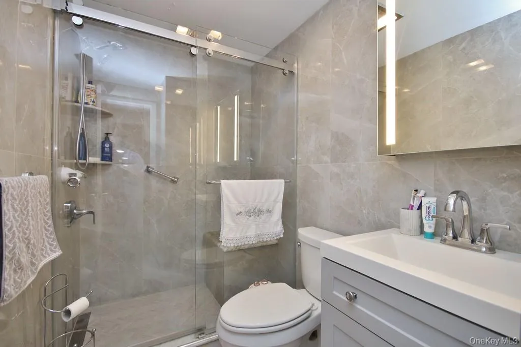 Updated hall bath has oversized shower and sink with vanity Updated hall bath has oversized shower and sink with vanity