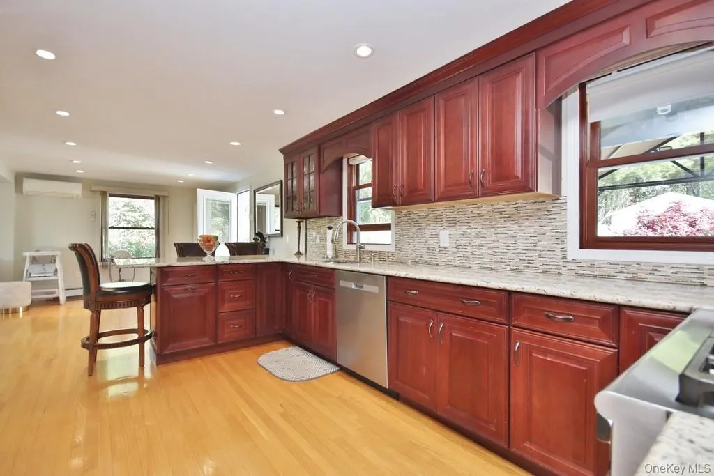 Kitchen has recessed lighting and hardwood floors Kitchen has recessed lighting and hardwood floors