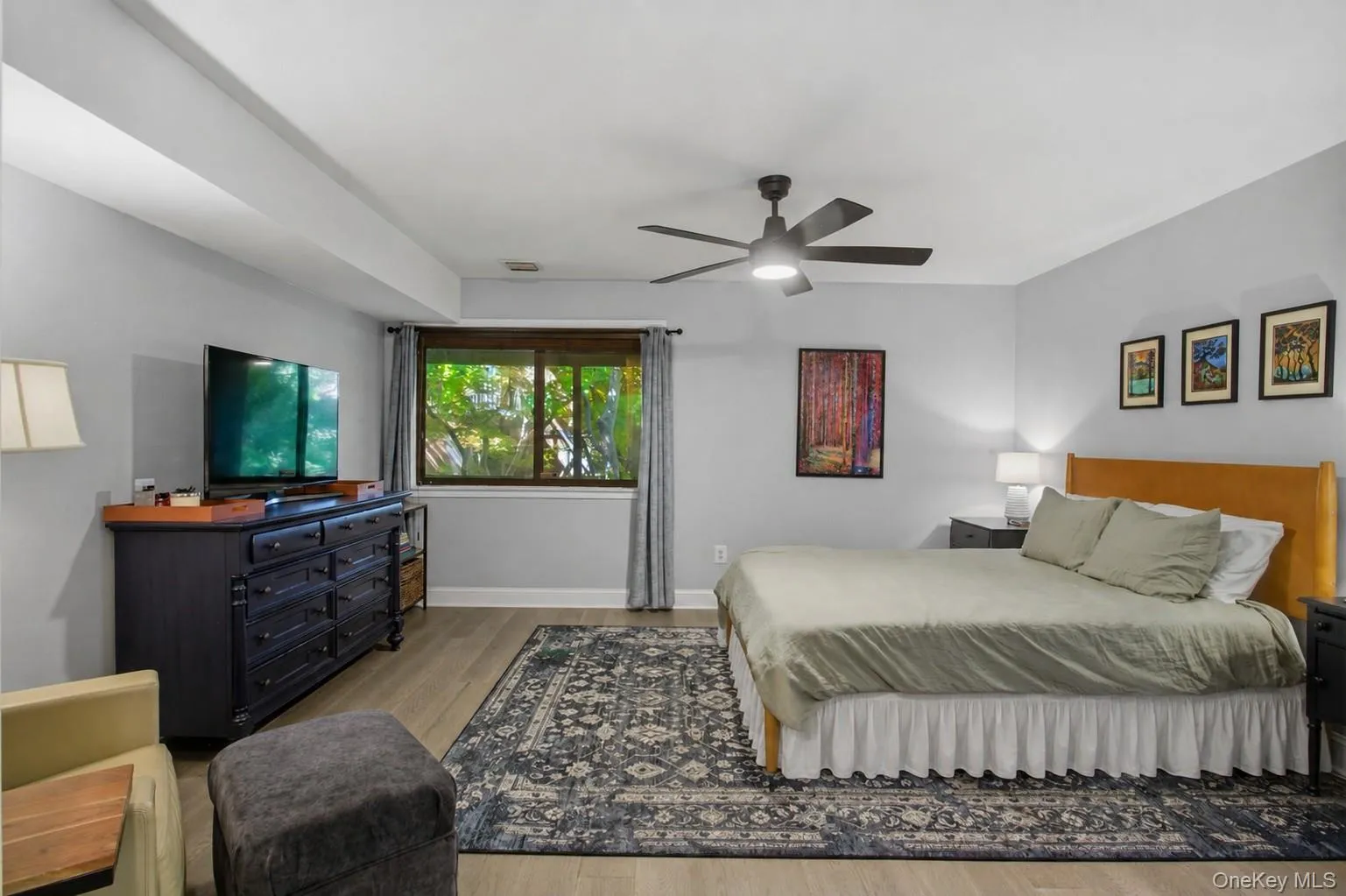 View of the spacious primary bedroom equipped with two closets, a vanity area and an en-suite bathroom. View of the spacious primary bedroom equipped with two closets, a vanity area and an en-suite bathroom.