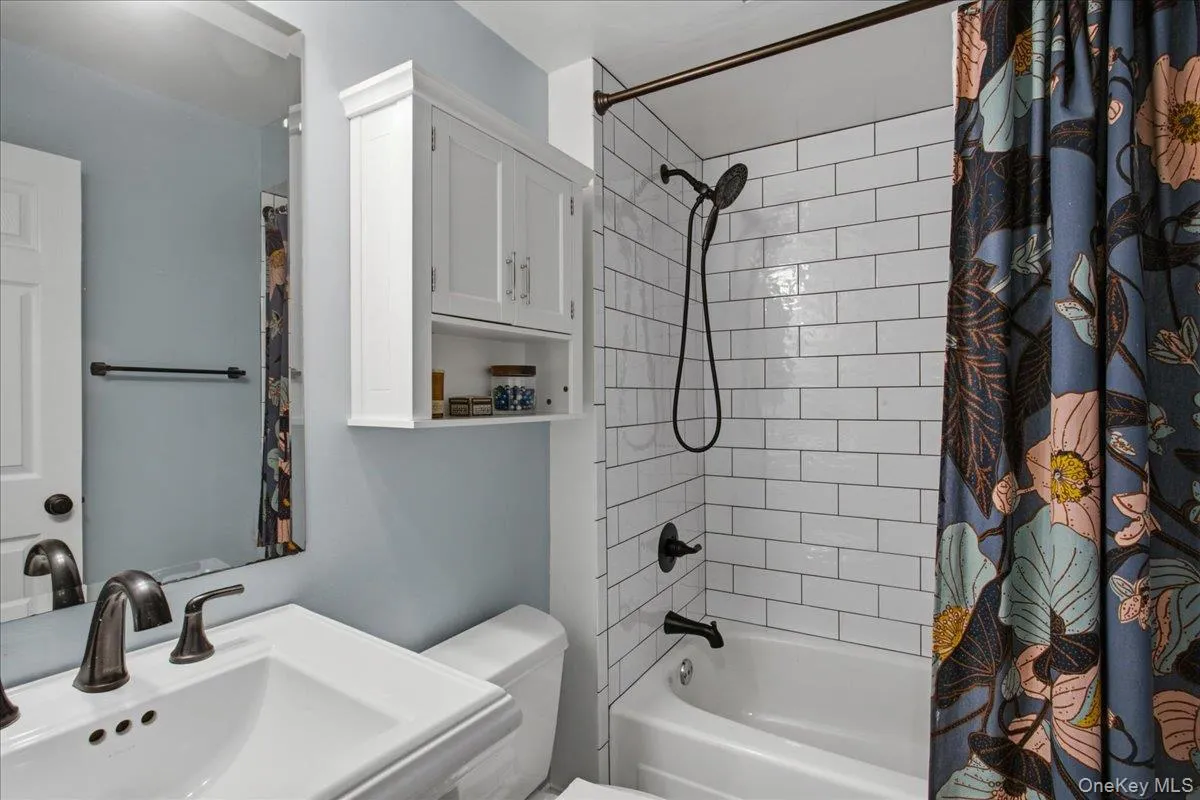 View of the renovated hall bathroom. View of the renovated hall bathroom.