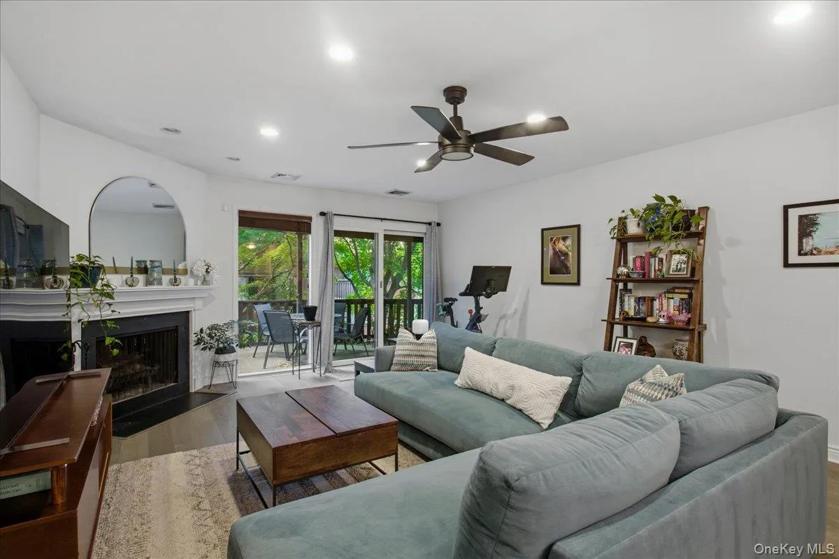 The large living room offers a fireplace for cozy winter nights and double sliding doors leading onto your own large patio. The large living room offers a fireplace for cozy winter nights and double sliding doors leading onto your own large patio.