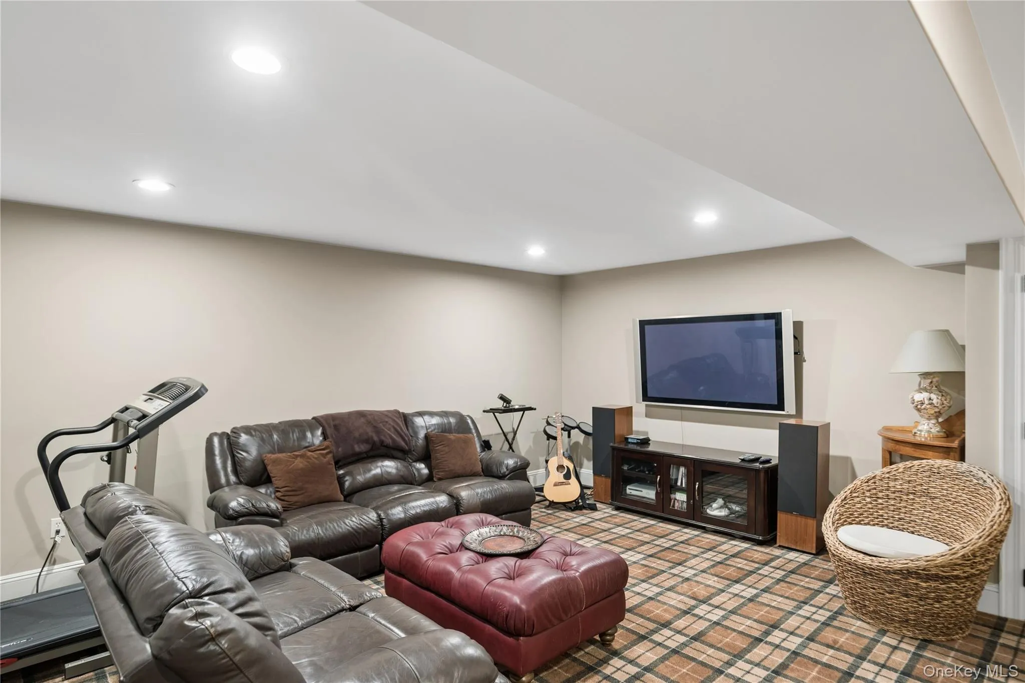 Finished basement with multiple sitting areas Finished basement with multiple sitting areas