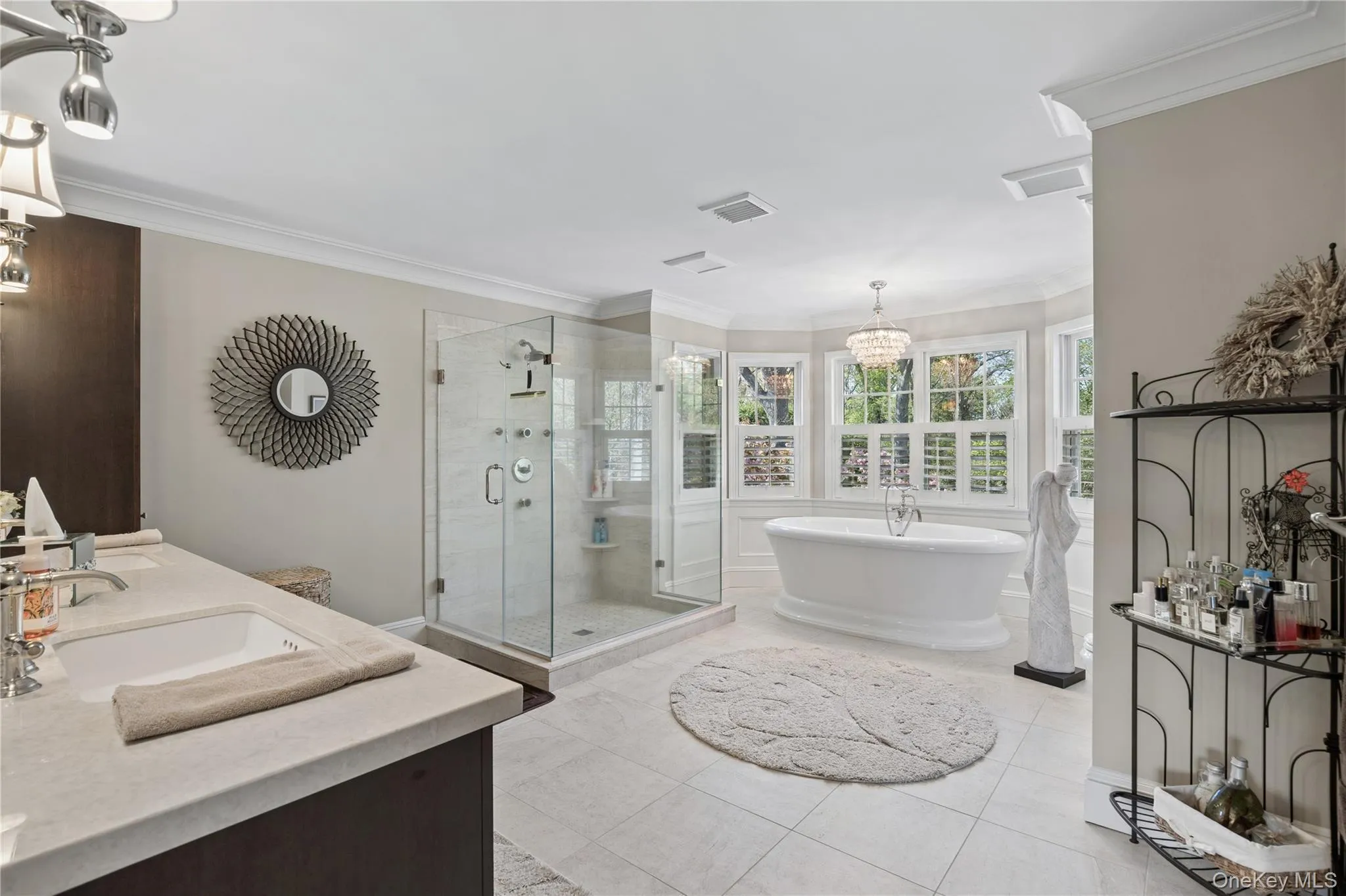 Primary bathroom with walk in shower, free standing air tub, custom wooden shutters Primary bathroom with walk in shower, free standing air tub, custom wooden shutters