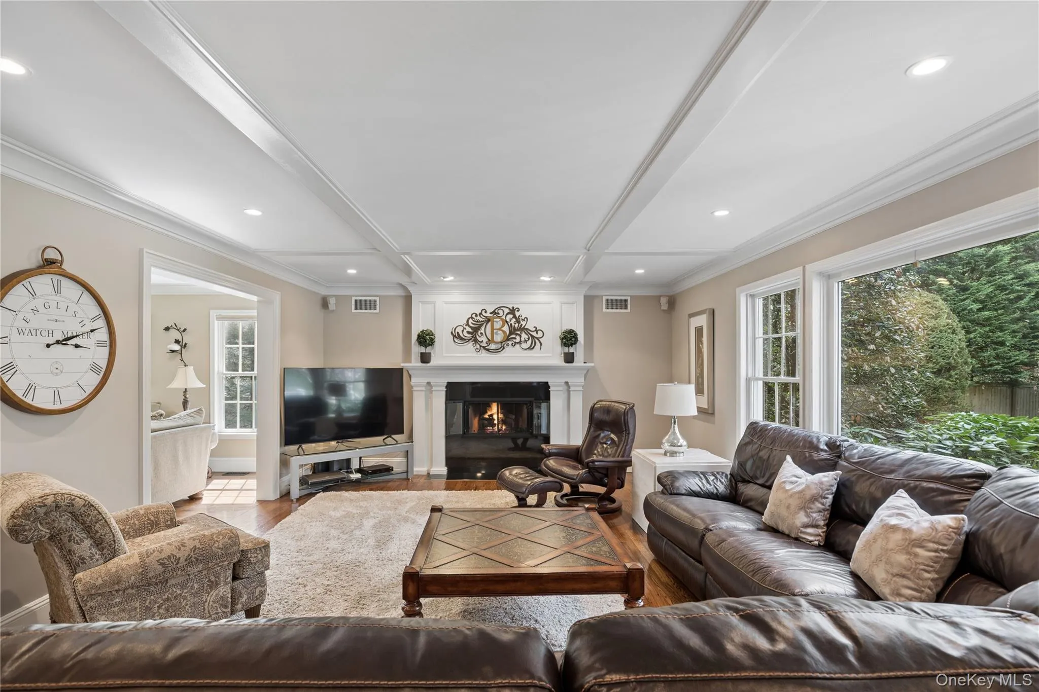 Den, GAS Fireplace, granite hearth and accent molding above fireplace. Picturesque windows Den, GAS Fireplace, granite hearth and accent molding above fireplace. Picturesque windows
